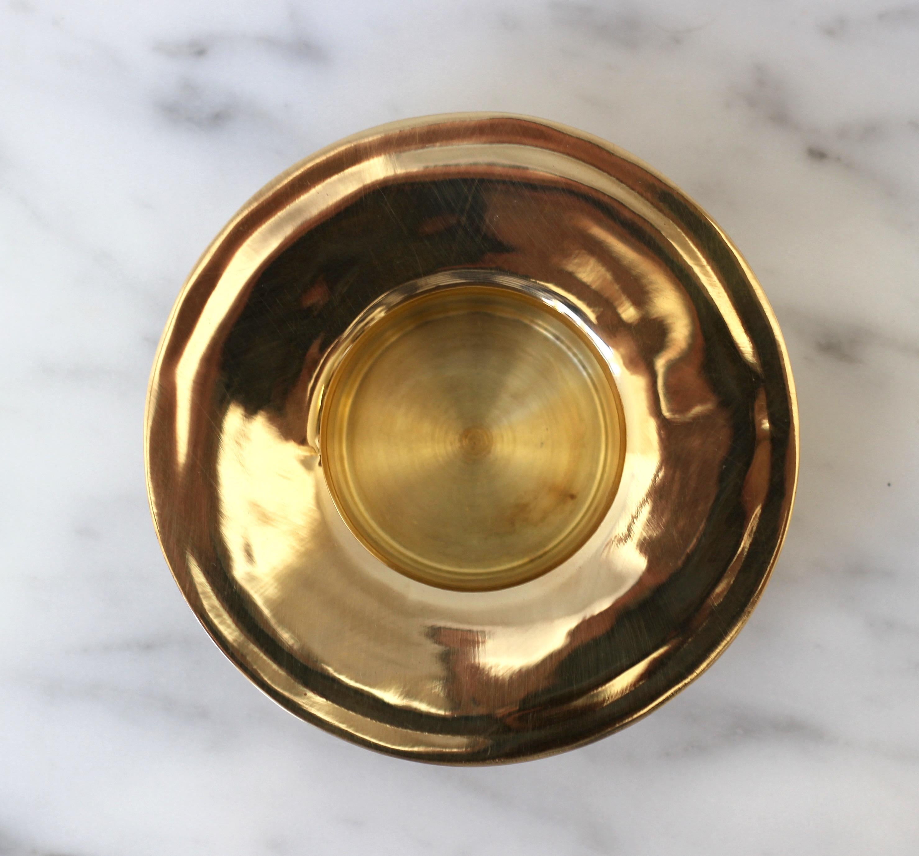 This very charming brass tea light holder is the perfect accessory for modern or more vintage themed interiors. It is very Minimalist, elegant and can be used in any setting. A perfect gift for any occasion.

Dia. 9.5 cm (3.7