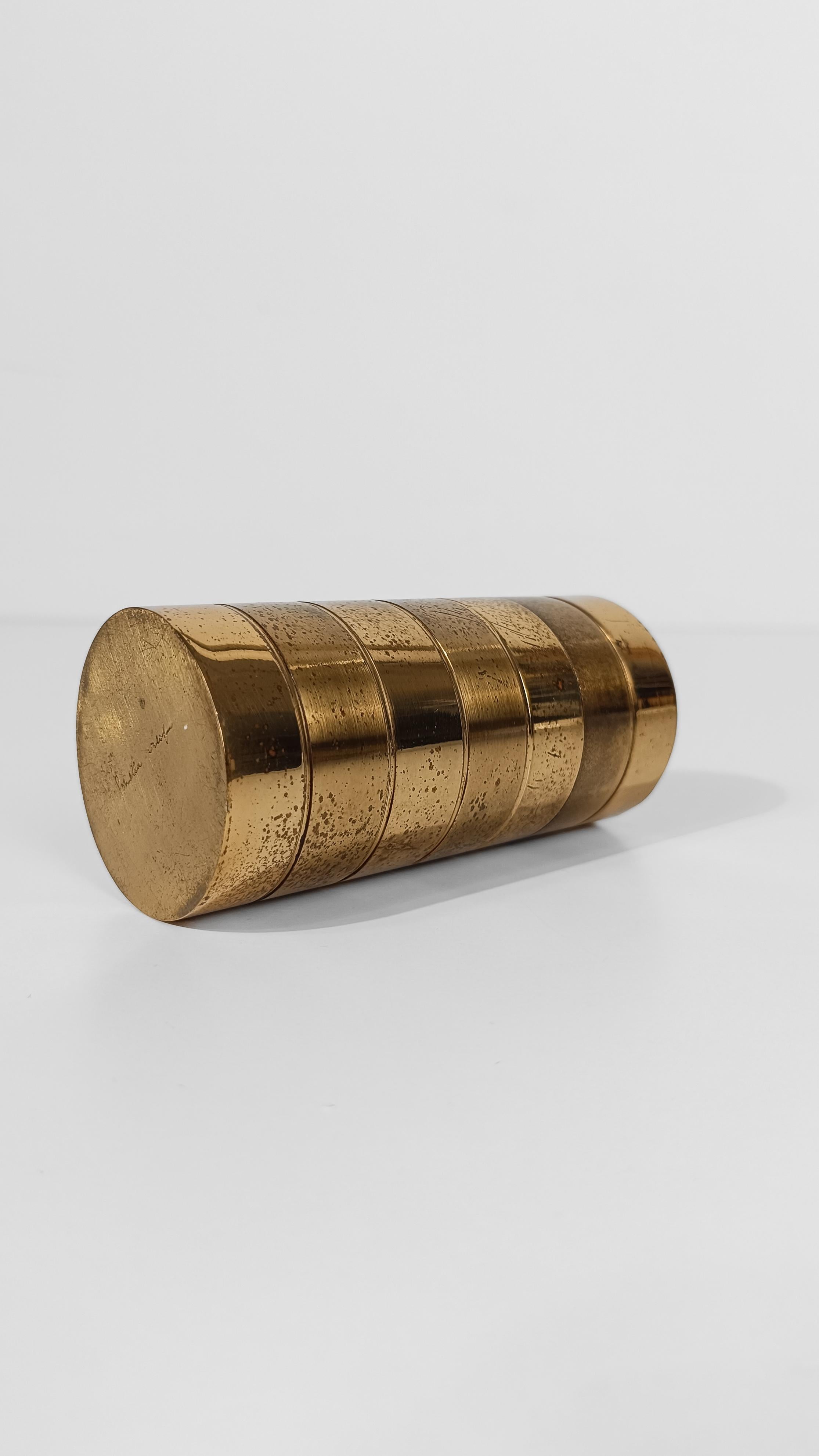 I'm offering for sale a rare cylindrical box, designed and signed in the 1970s by Italian designer Gabriella Crespi.
The cylindrical tube shape suggests that this vintage box was most likely designed to function as a cigarette case.
Lightweight and