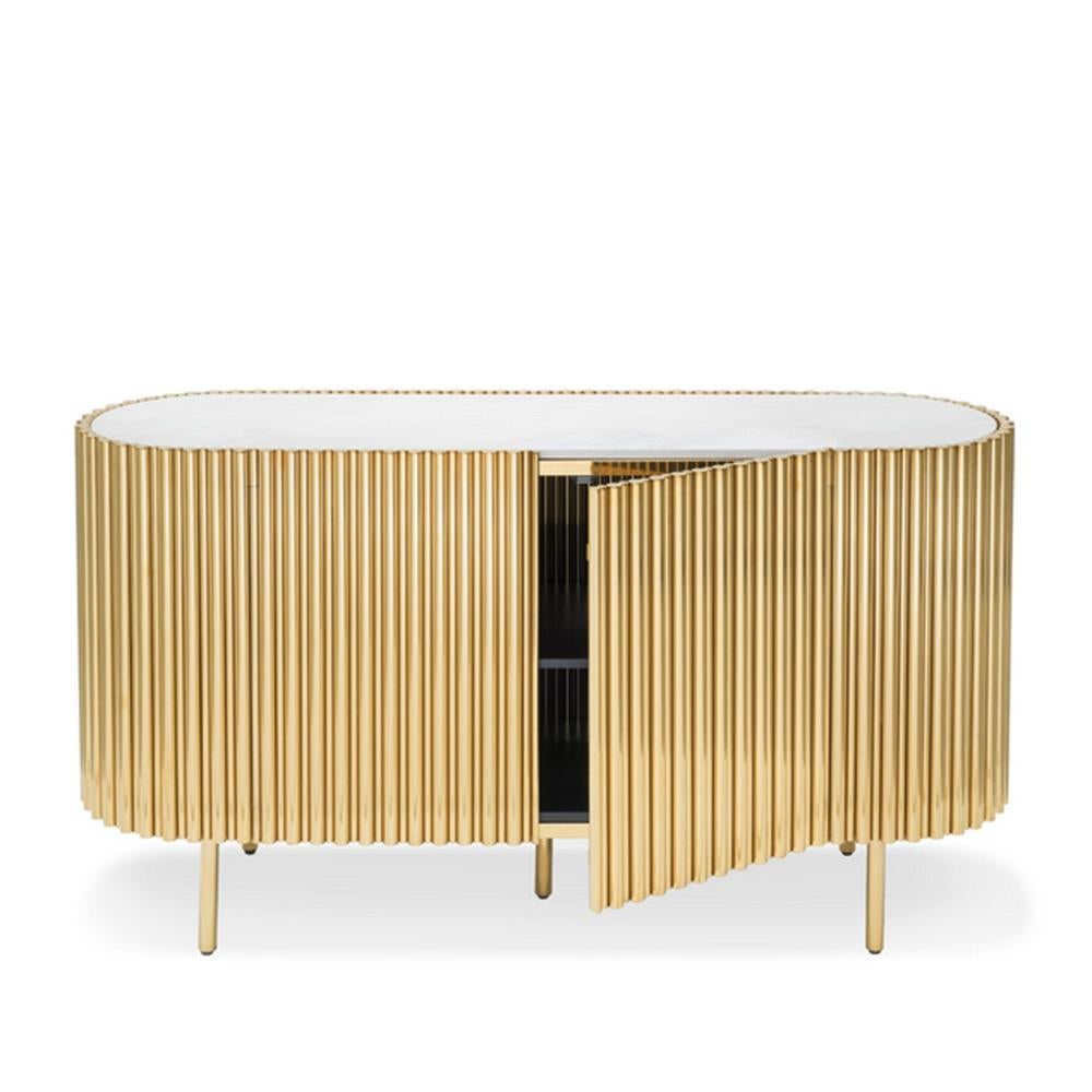 Sideboard brass tubes white oval with steel structure in gold
finish and with white resin marble top. With 2 doors and 1 shelf.
