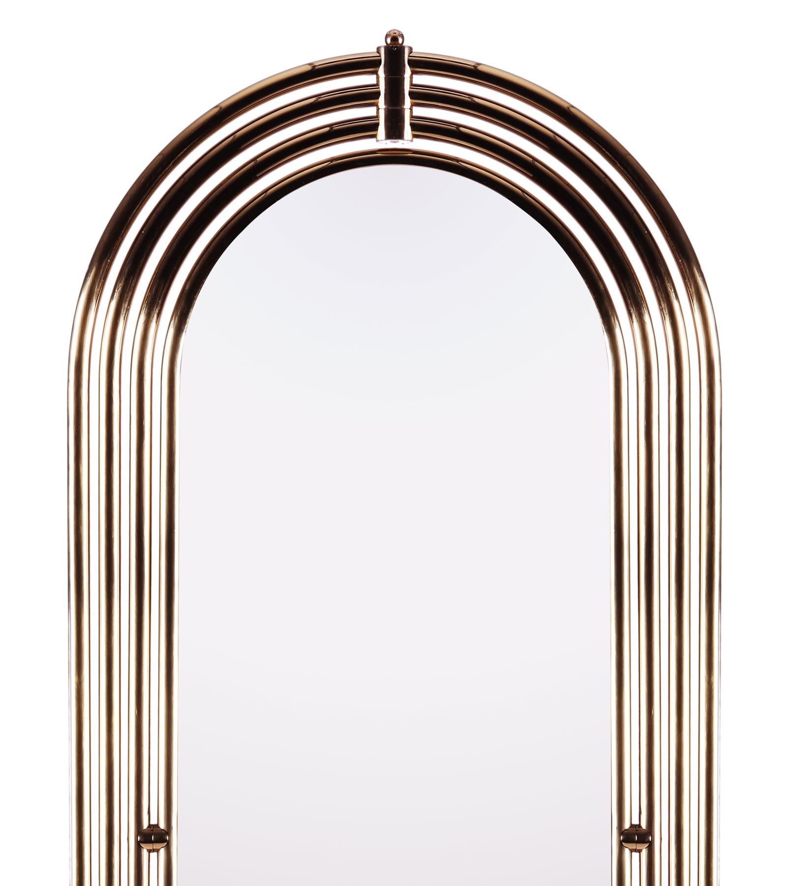 Floor mirror brass tubular with LED light with
polished brass tubular frame structure. Led
light system included in brass tubular frame.
Rotate mirror on 360 degrees axis on black
marble round base with brass trim around.
With beveled mirror