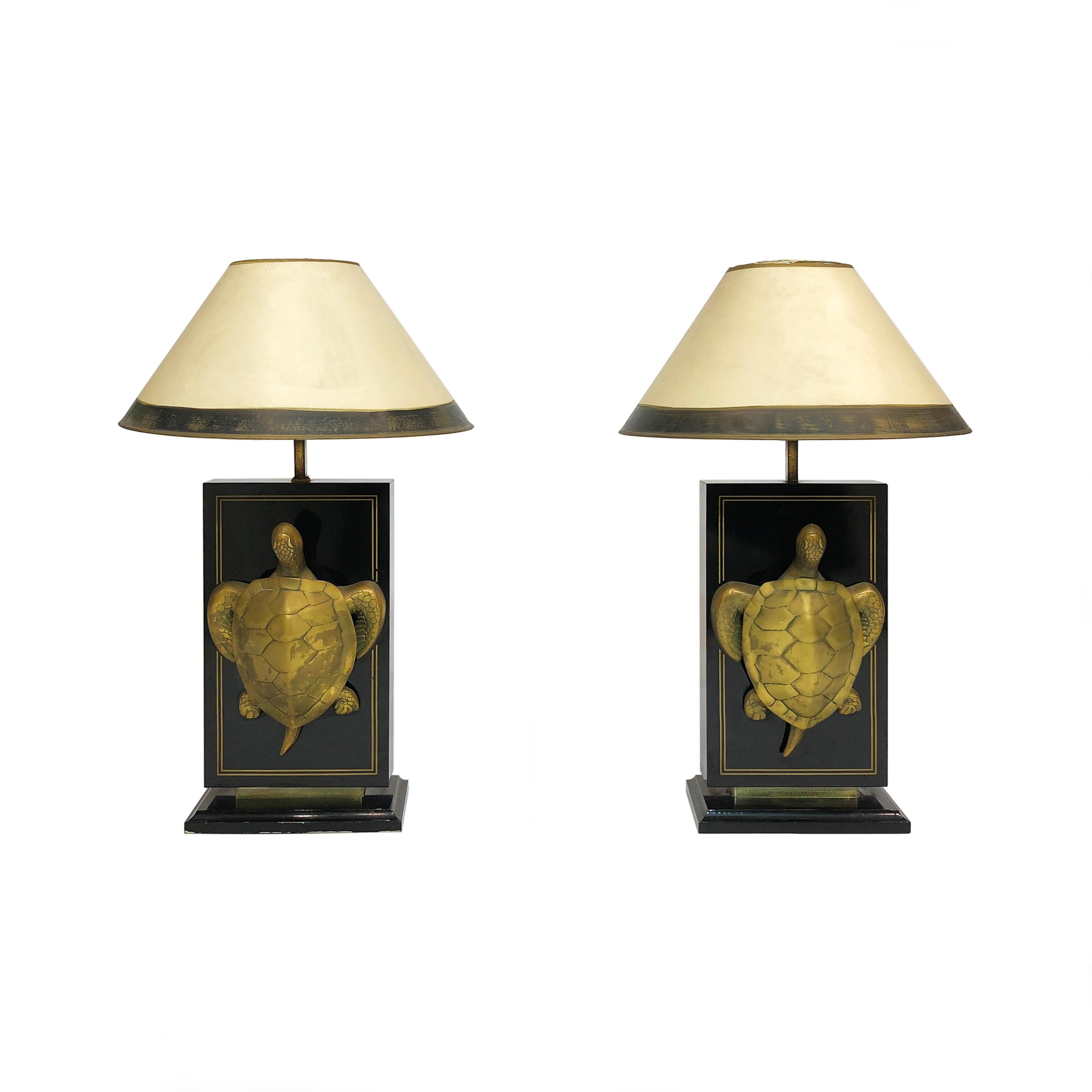 This pair of visually striking brass table lamps depict the protected sea turtle of the French overseas colony Martinique. Stamped “Macouba” on the bottom, the lamp itself is an elegant rectangle of black lacquered veneer, from which protrudes a