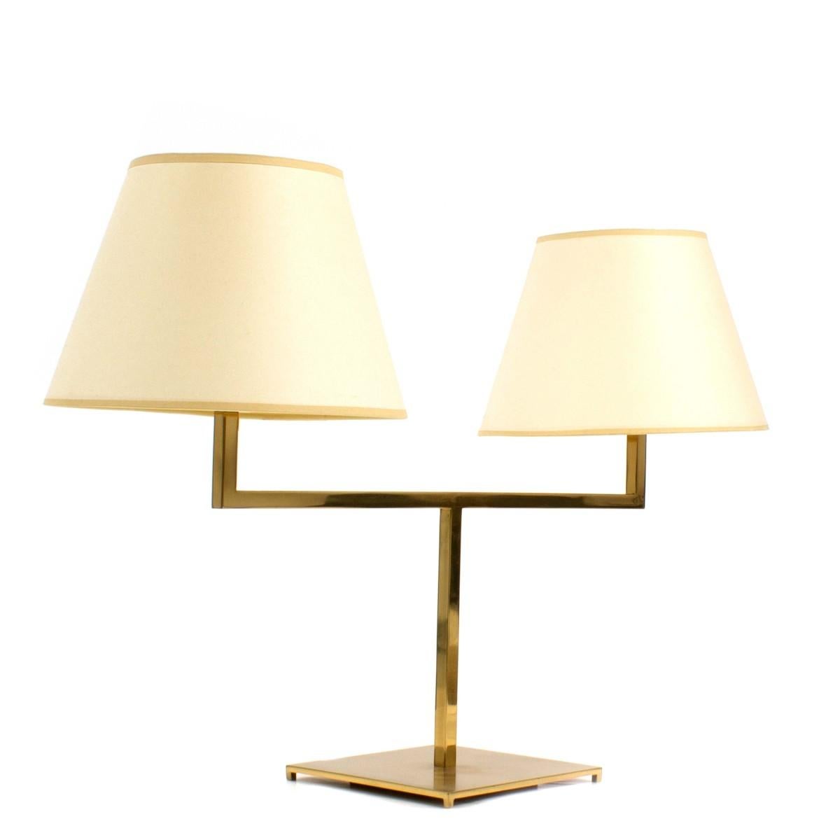 A brass two-arm library style desk lamp with shades by George Hansen. USA, circa 1960.

Dimensions:
33.5 inches L
8.5 inches D
22 inches H.