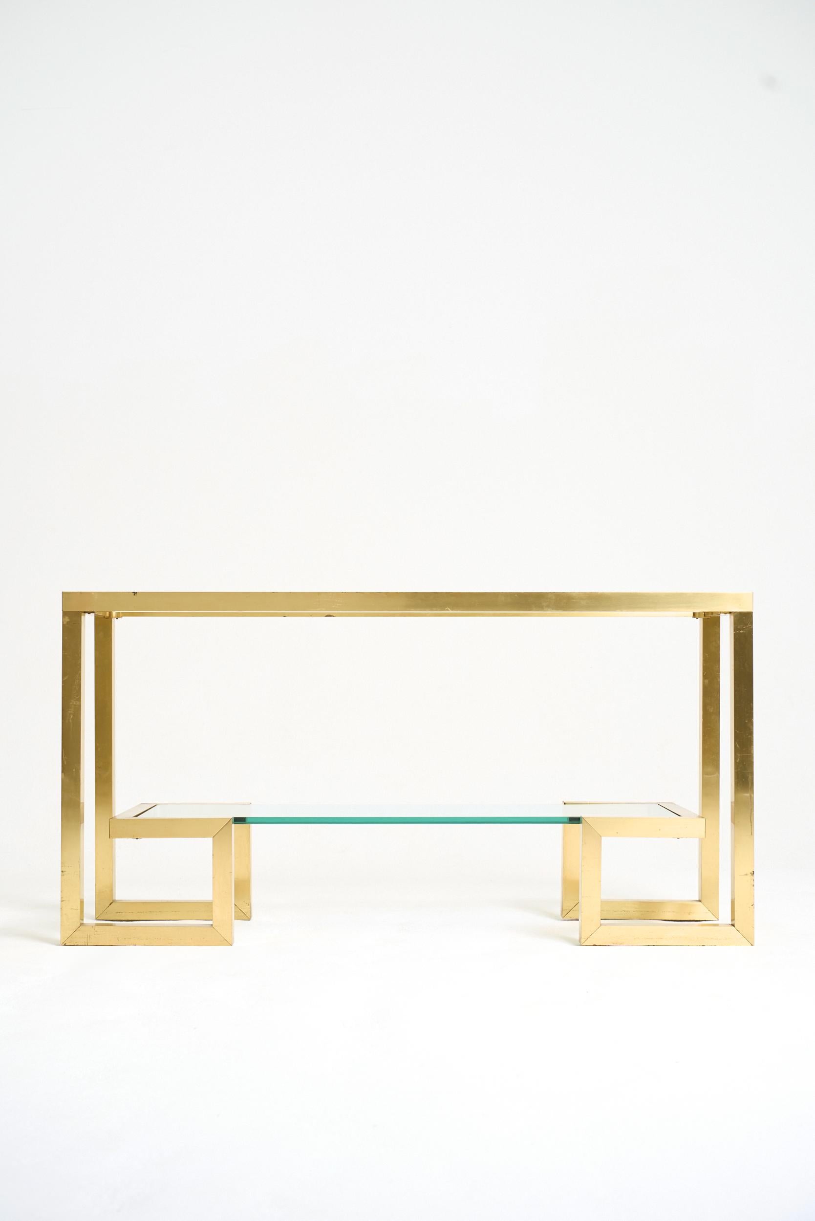 A brass and glass two-tier console table
France, Circa 1970
