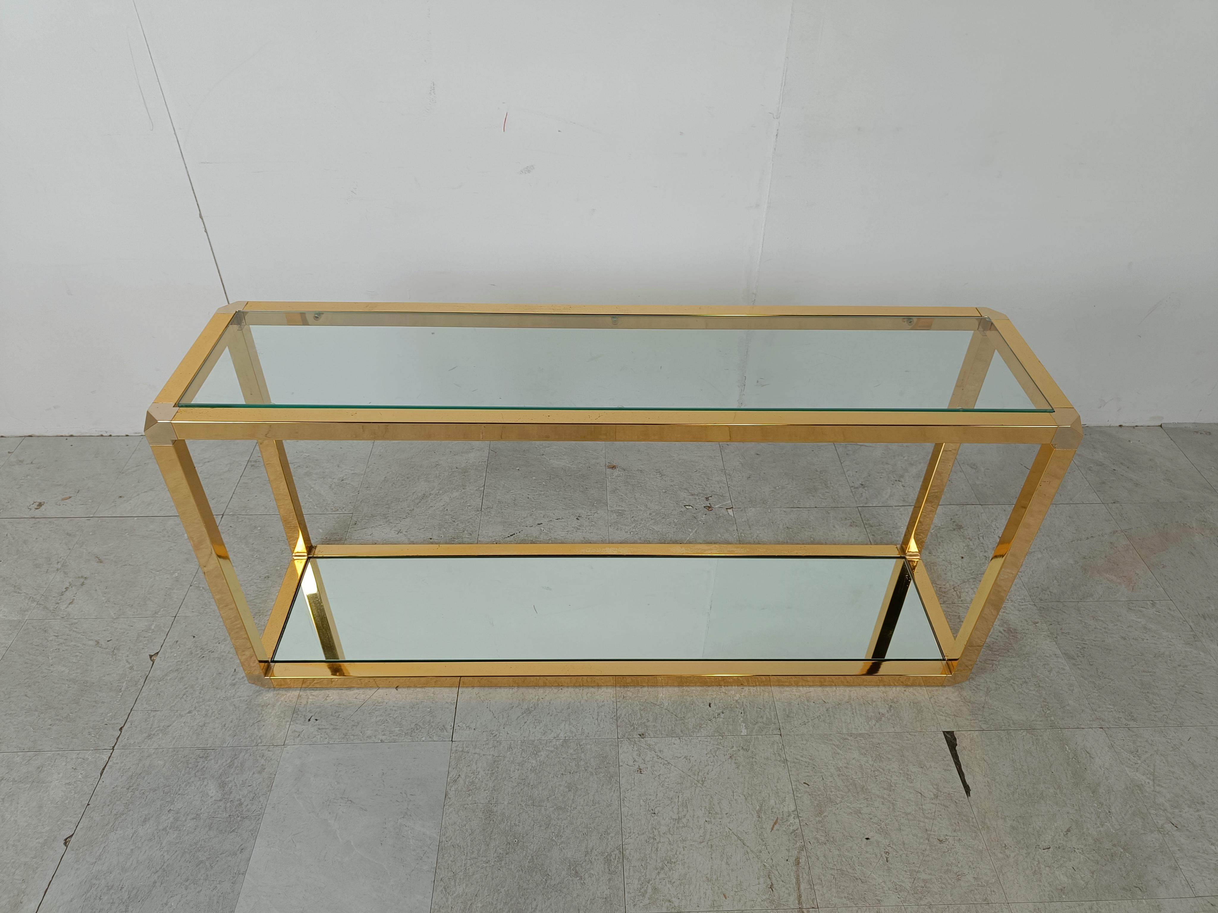 Brass two tier console table with mirrored glass.

Good quality piece of furniture that adds a touch of seventies glamour in to your interior.

1970s - Belgium

Dimensions:
Height: 65cm/25.59