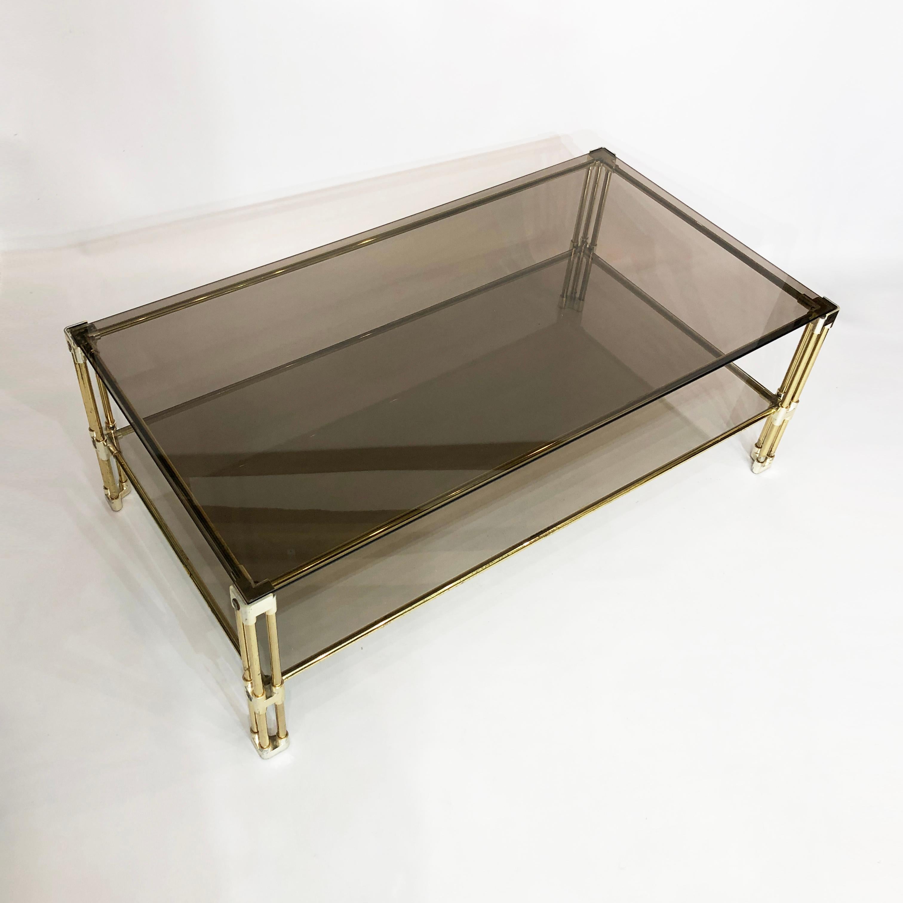 Italian Brass Two-Tiered Coffee Table Hollywood Regency Gold Smoked Glass 1970s Glamour For Sale