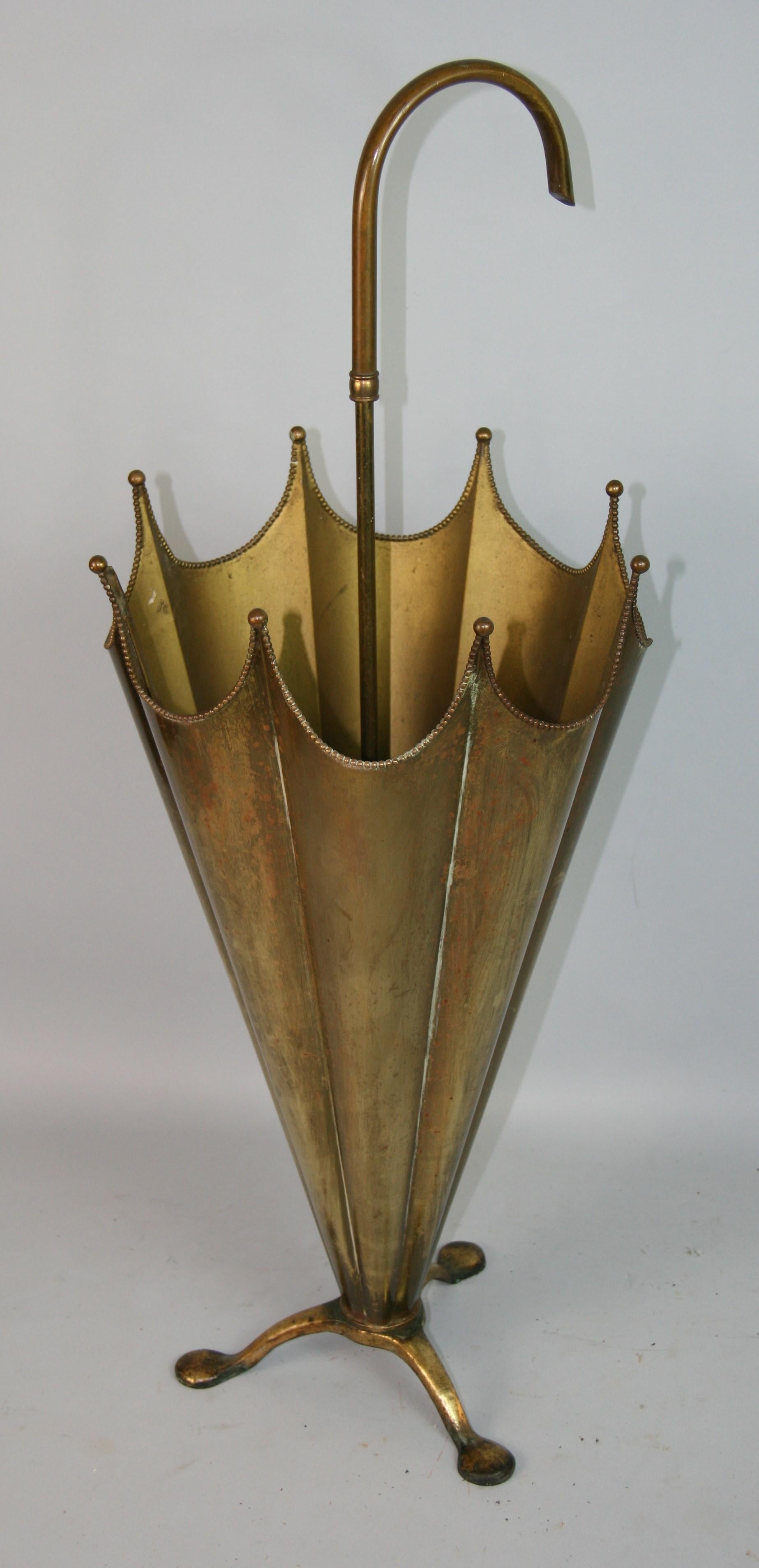 1489 Brass umbrella shaped umbrella stand.
Rich patina is a testament to its years of age and use