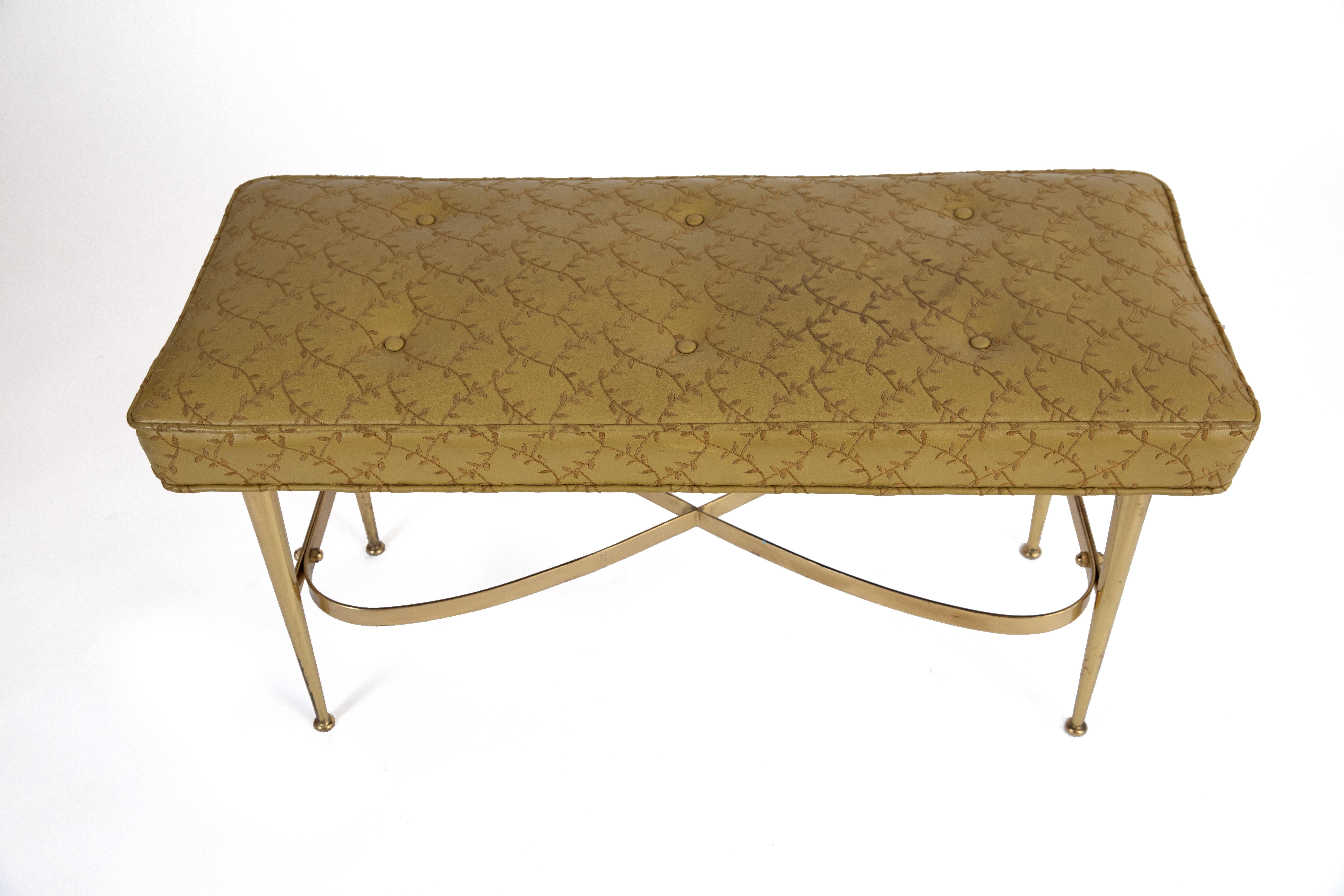 Brass and upholstered bench from Italy, circa early 1960s. This all original example has sinuous patinated brass legs and retains its original upholstery.
We can also upholster this in the leather or fabric of your choice.