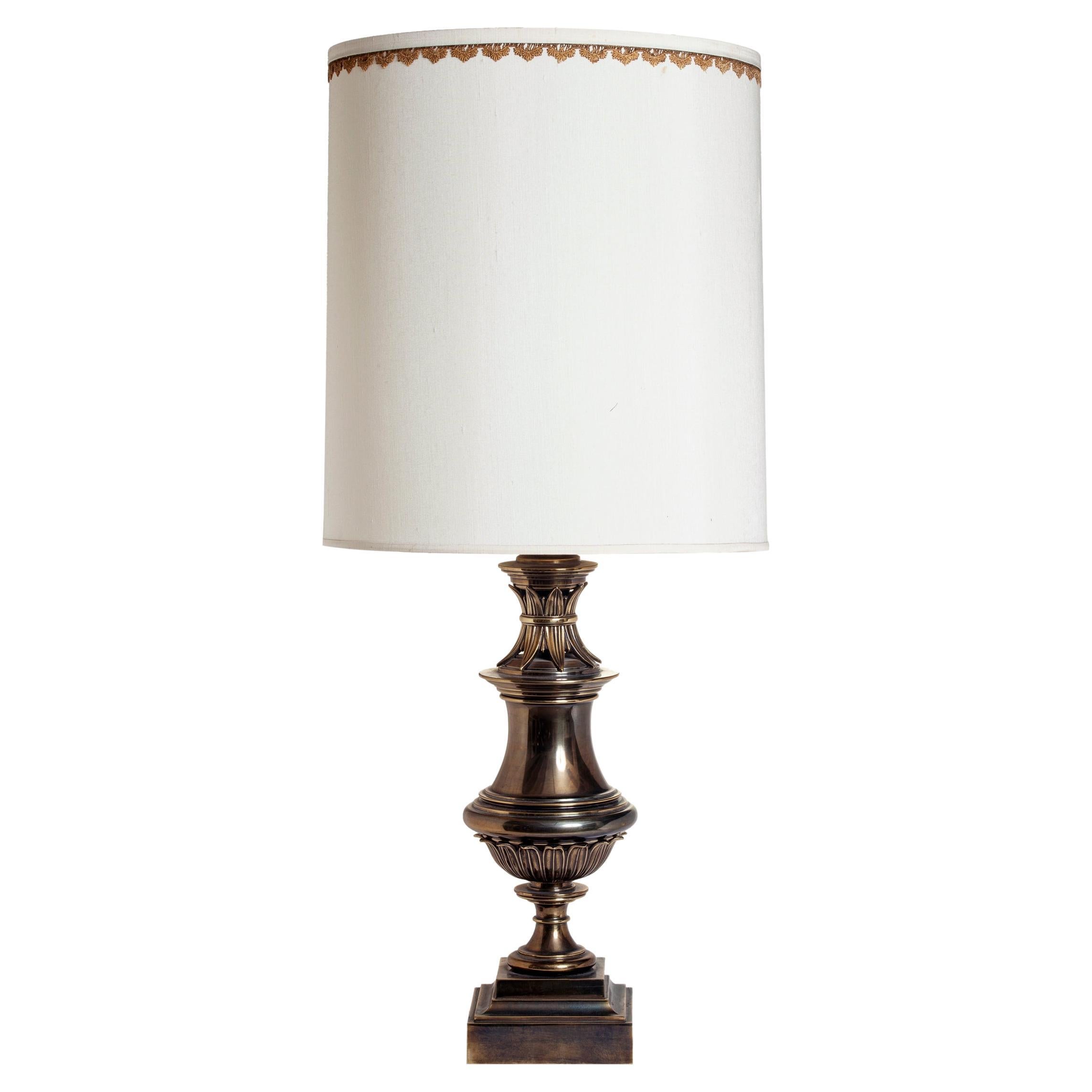 A stylish midcentury brass urn lamp by Stiffel with the original shade.