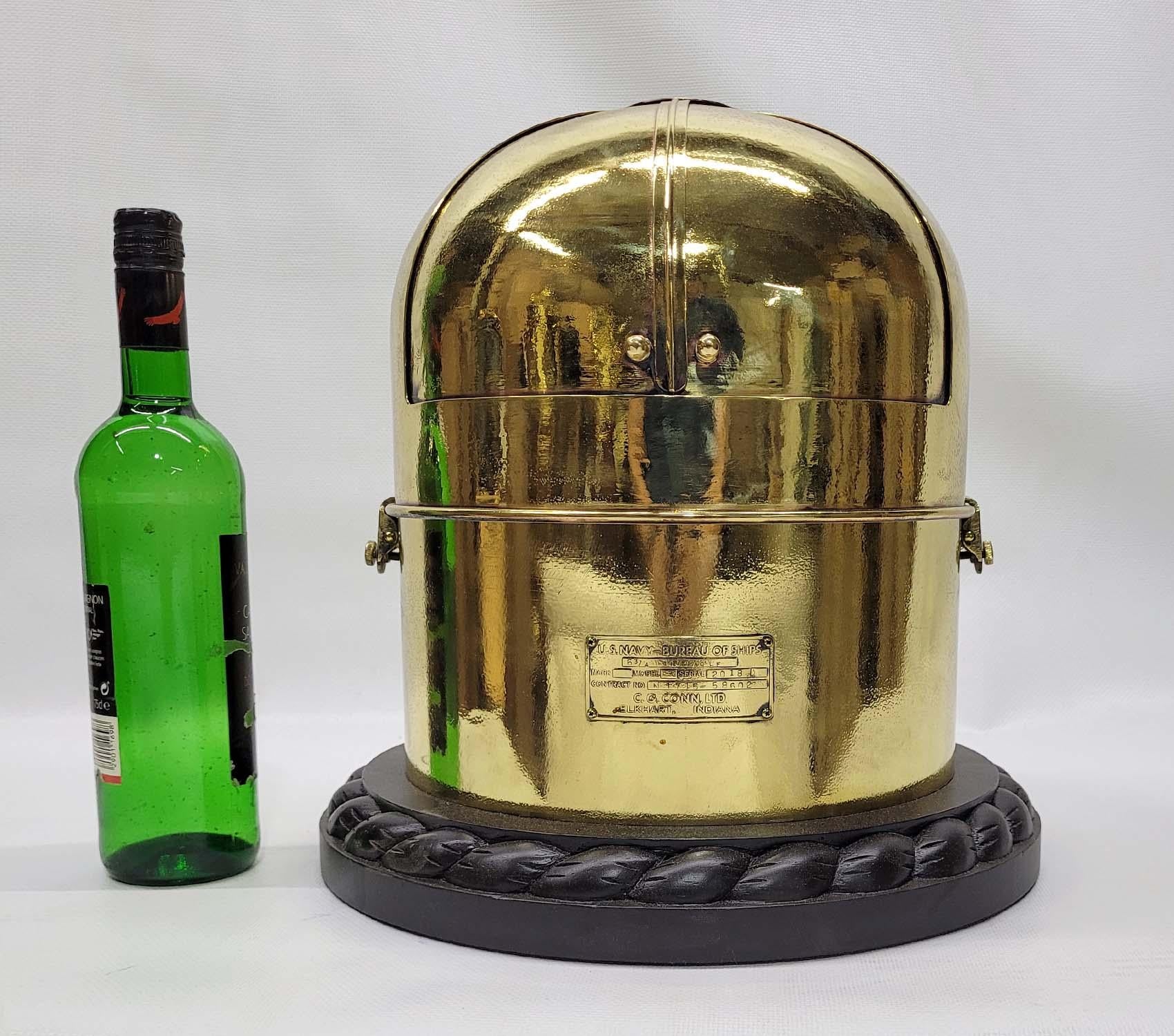 Solid Brass highly polished boat binnacle with makers plate which reads “US Navy Bureau of Ships, C.G. Conn, LTD Elkhart Indiana. Fitted with a compass from John Bliss of New York. 

Weight: 30 lbs
Overall Dimensions: 14