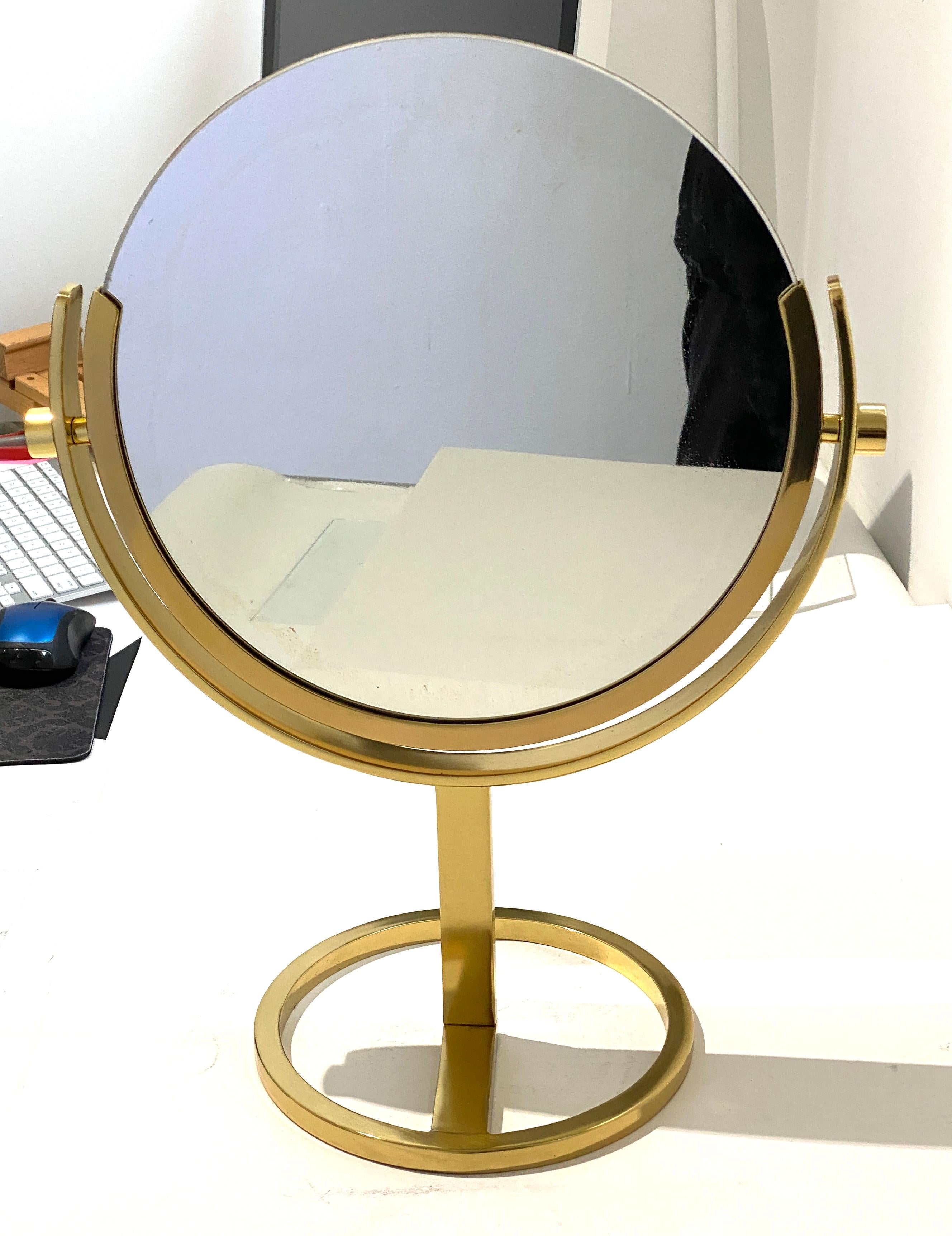 This stylish and chic double sided vanity table mirror dates to the 1970s and was created by Charles Hollis Jones. 

Note: The piece has been professionally polished and lacquered (so no tarnishing).

Note: The mirror does not have any magnification