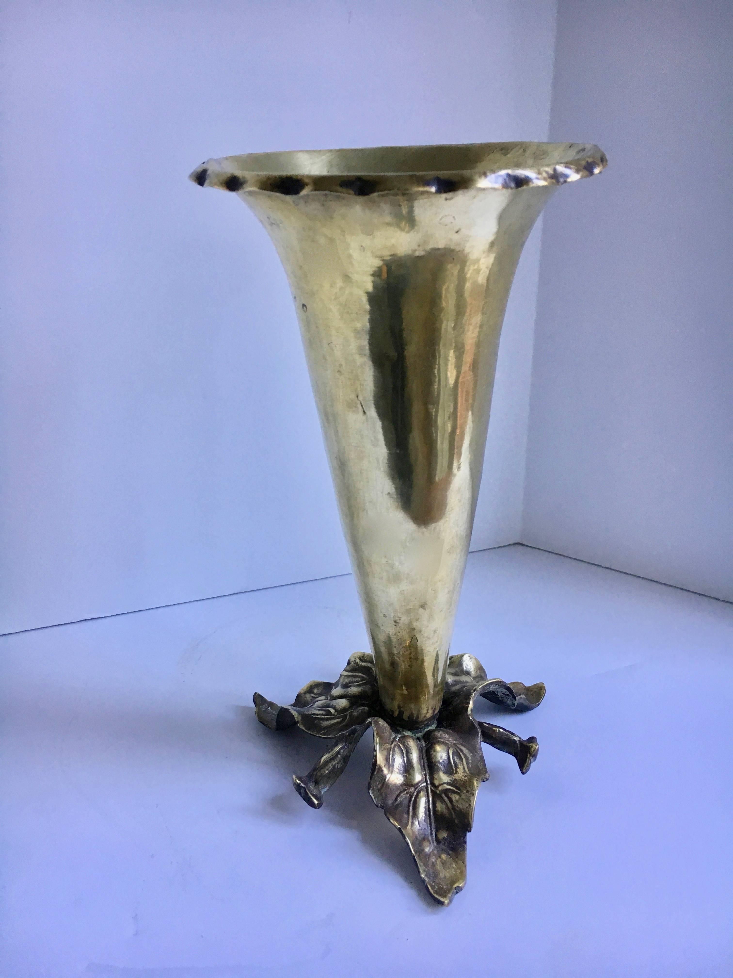 Brass vase with sculpted leaves base - a lovely vase for any room - a trumpet style vase with leaves as the base that holds the vase in place.
