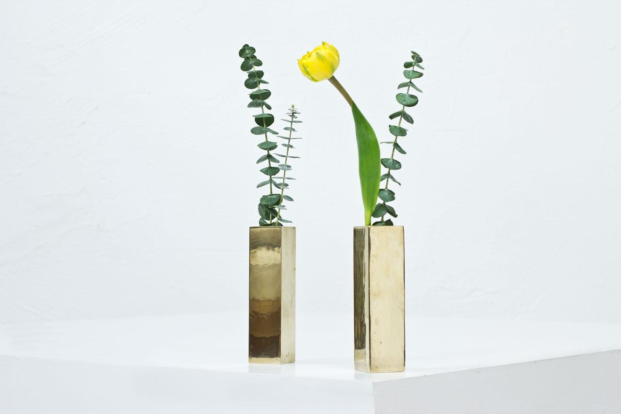Beautiful pair of solid brass vases from Karlshamn, Sweden. 
Manufactured during the 1960s. 
Very decorative and warmful, can be used as candle holders as well !

Condition: very good condition with patina and minor signs of wear.

Those beautiful