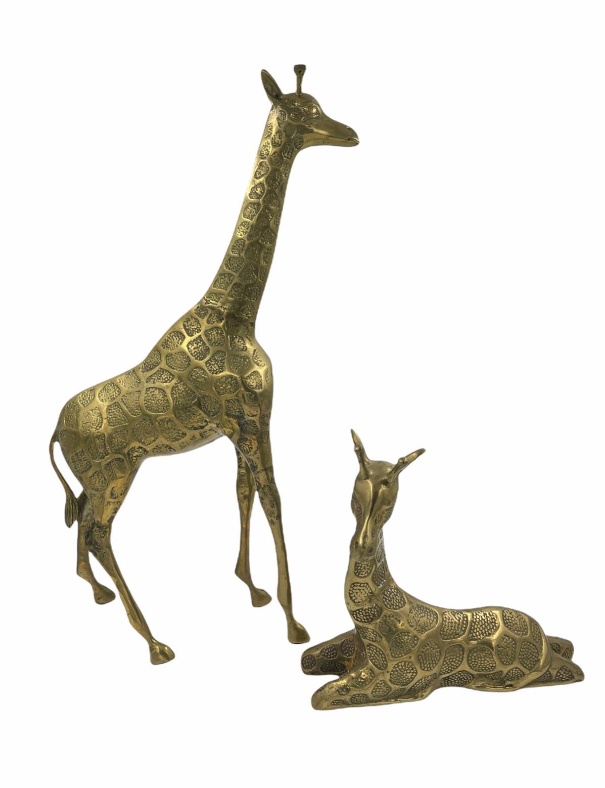 These sculptural giraffes are a great addition to your shelves or table! They are a great size for a subtle statement piece. Great vintage condition with some patina. 

Standing giraffe: 22.25”H x 11.5”L x 3.25”D

Laying giraffe: 10.25”H x