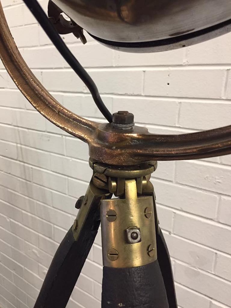 This is an original medical theatre light manufactured in the early 20th century. This has been cleaned, polished and re-wired to take a standard household bulb and is in good working order. Fully working and this tripod is an example of a very