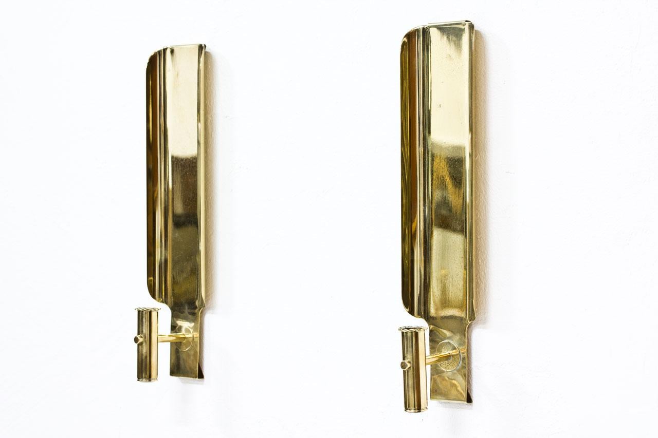 Rare pair of wall candleholders designed and produced by Hans–Agne Jakobsson in Sweden during the 1960s. Model L141. Made from brass. Labeled.