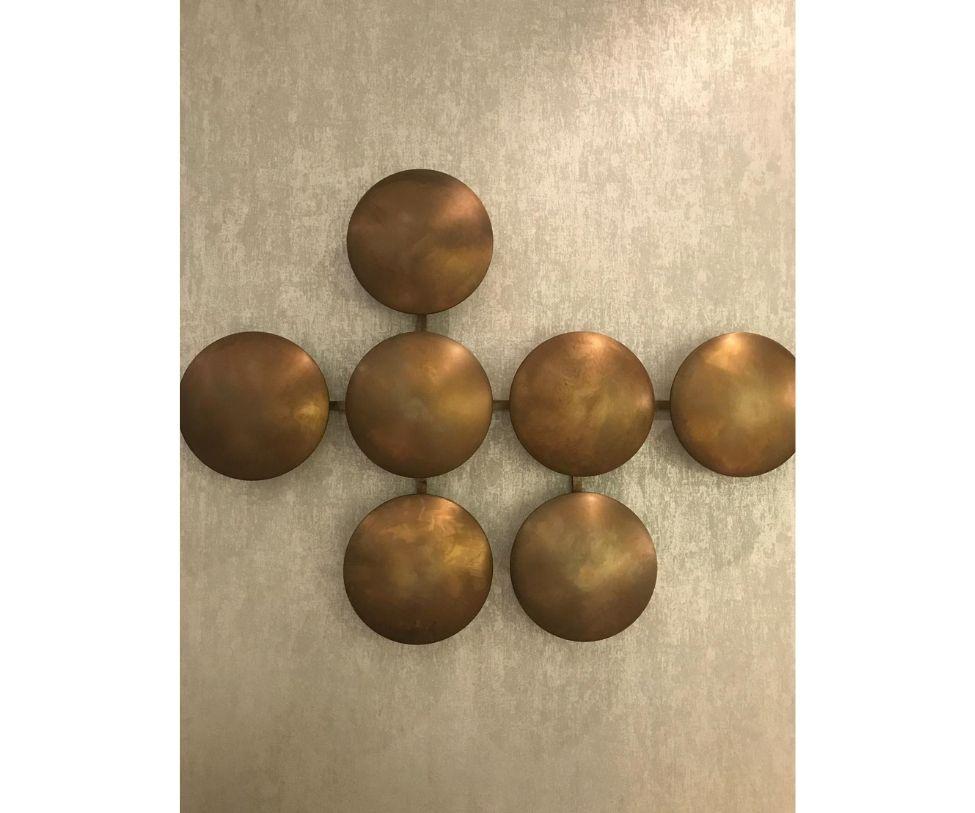 Create a wall of warmth with customized clips that secure to your wall made of burnished brass.

More art installation than a light fixture, LED power-saving light clips are artistic and chic, emitting soft light while brightening up any bland