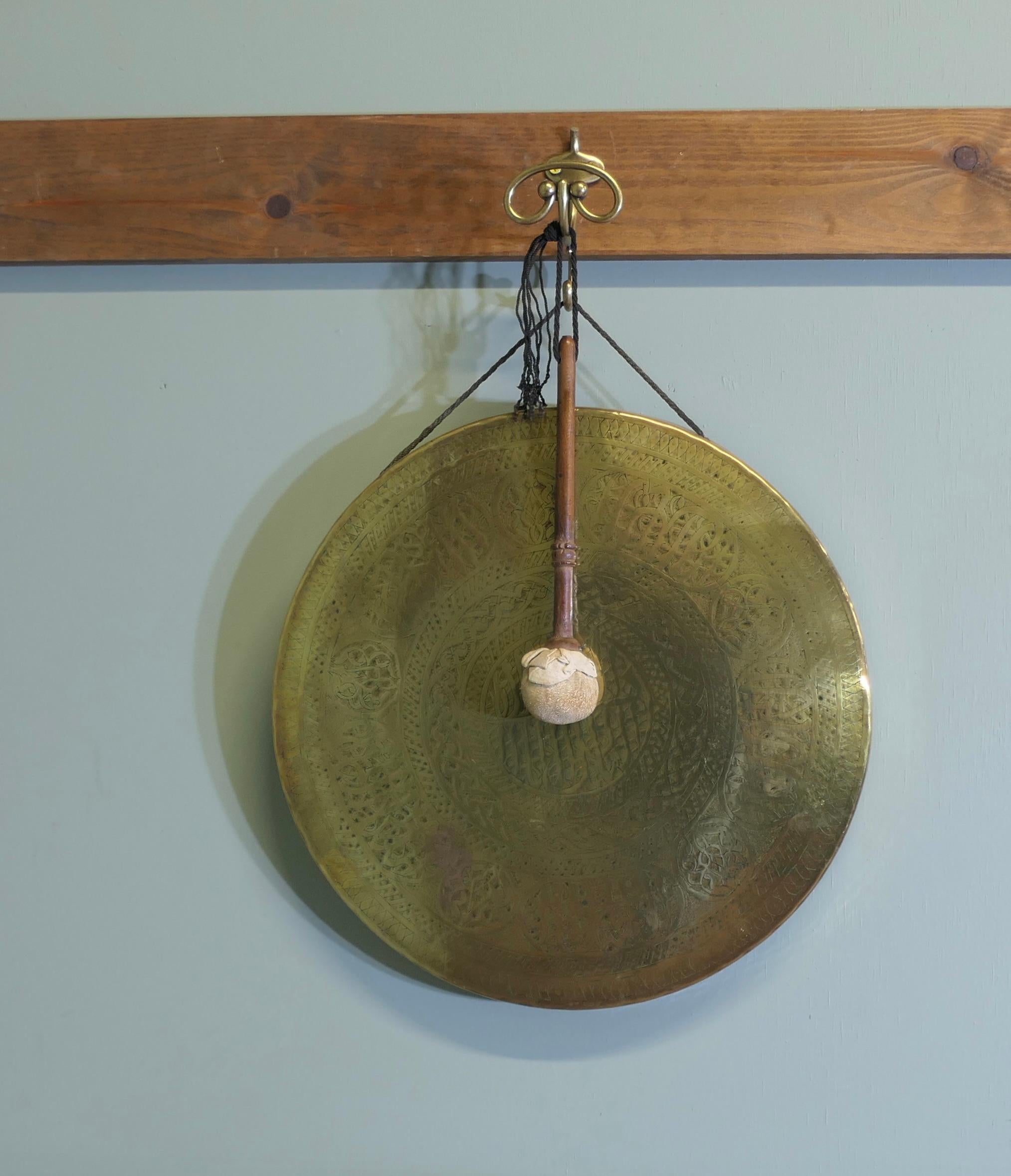 Brass Wall Hanging Dinner Gong

This is a very unusual piece the Brass Gong is suspended on a brass bracket, the gong is made in hammered brass, the gong has a good loud DONG

The over all height is 16” in diameter x 2” deep
ST167
