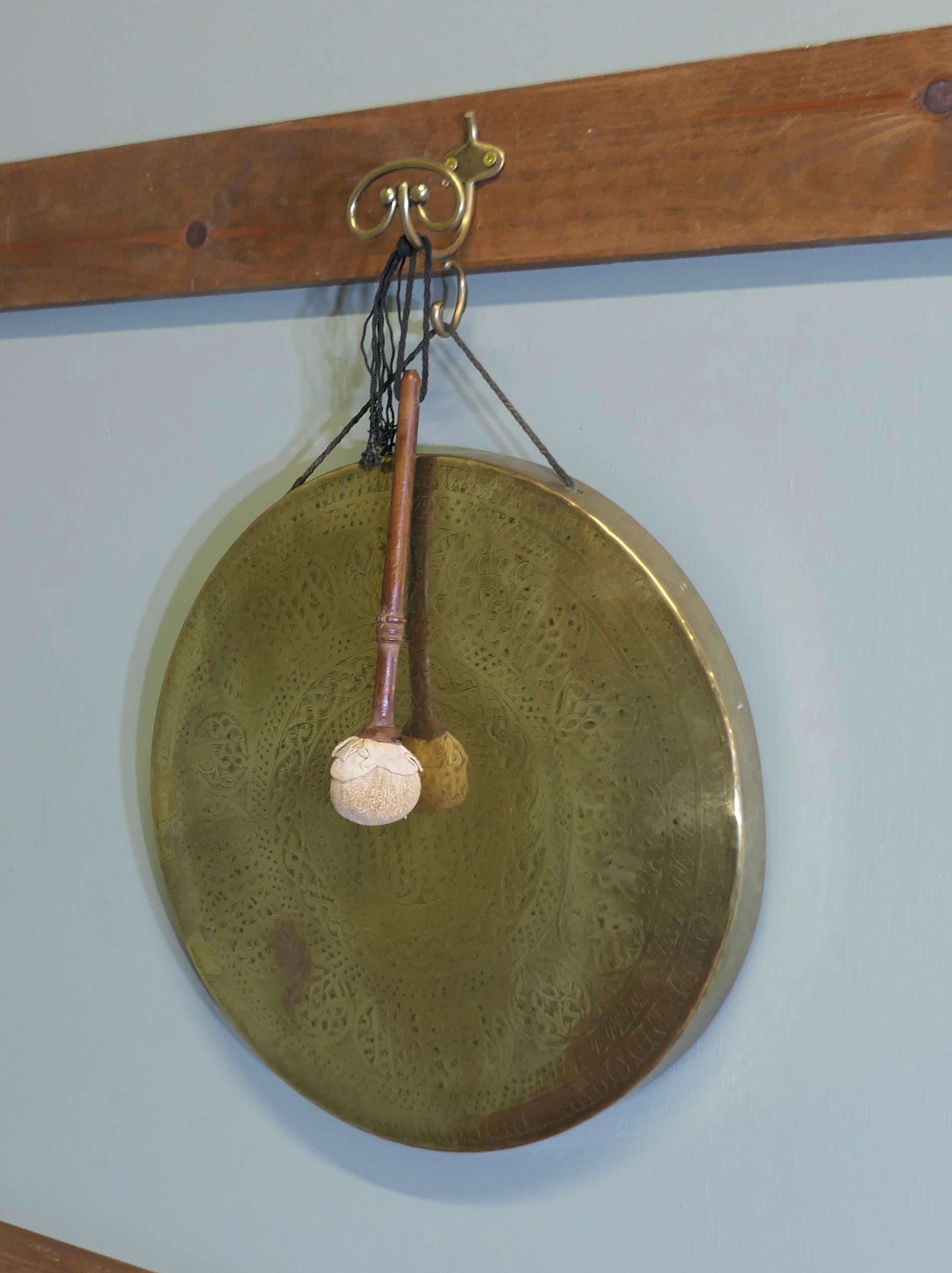 Early 20th Century Brass Wall Hanging Dinner Gong  This is a very unusual piece For Sale
