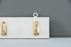 Brass Wall Hooks on Wood, circa 1920s