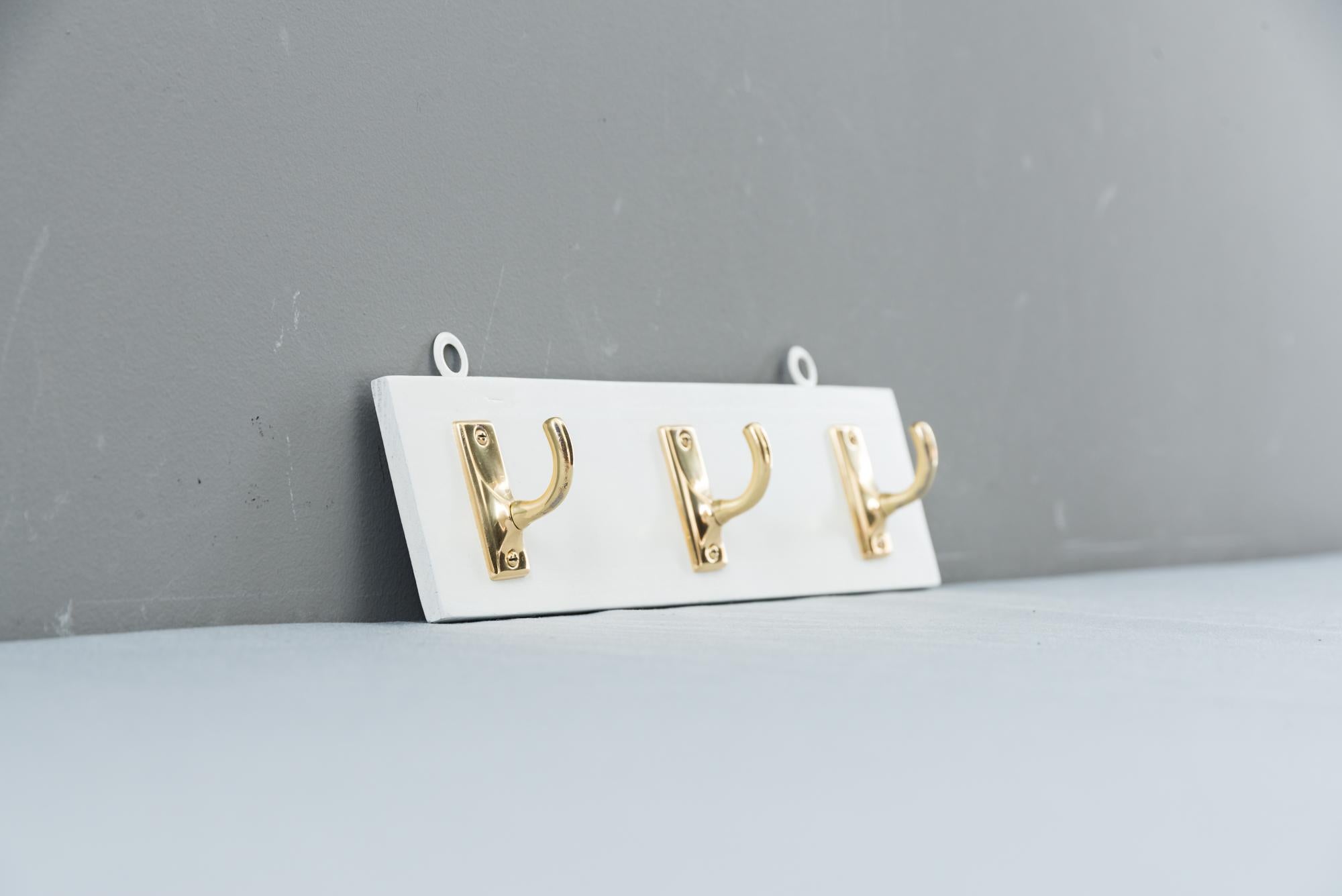 Brass Wall Hooks on Wood, circa 1920s In Good Condition For Sale In Wien, AT