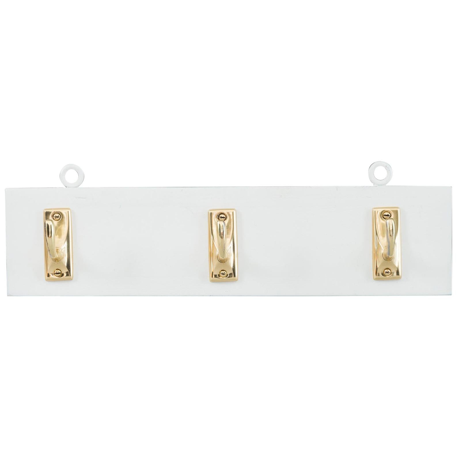 Brass Wall Hooks on Wood, circa 1920s For Sale