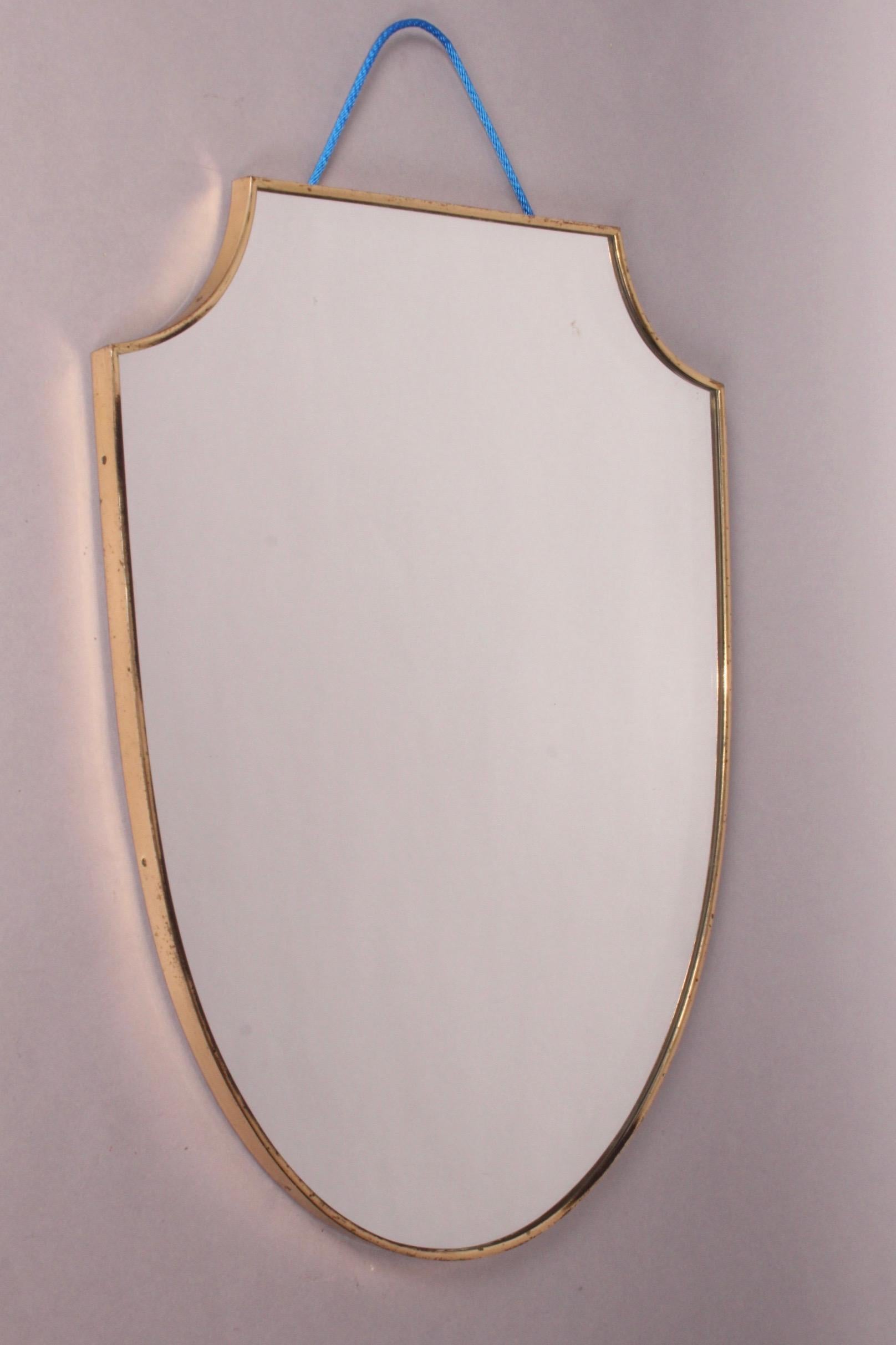 Brass wall mirror.