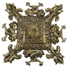 Brass Wall Plaque Decorated with Intertwined Sea Serpents and Fleur-de-Lis
