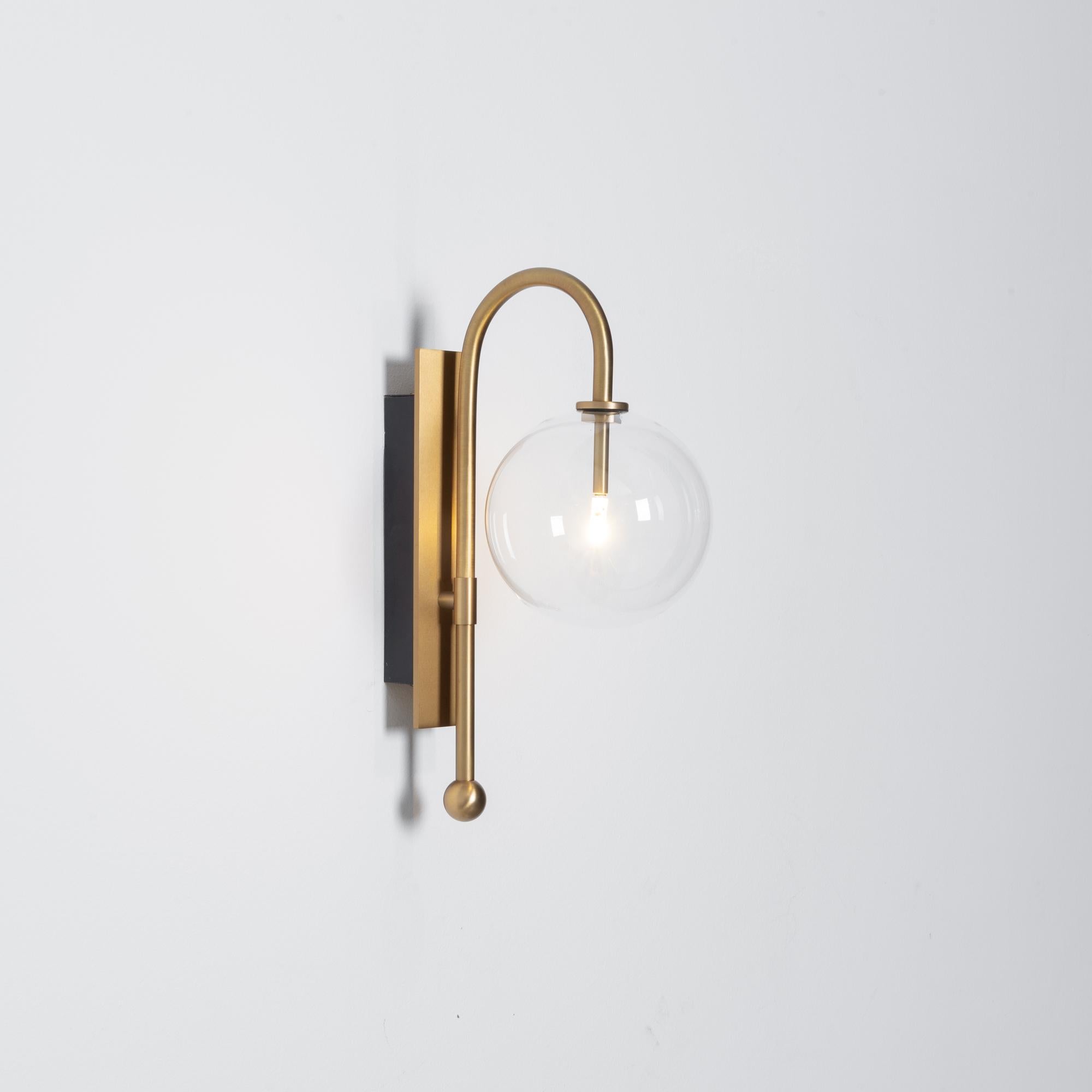 Naples Brass Wall Sconce by Schwung
Dimensions: W 15 x D 23 x H 37 cm
Materials: Brass, hand blown glass globes

Finishes available: Black gunmetal, polished nickel, brass
 

 Schwung is a german word, and loosely defined, means energy or momentumm