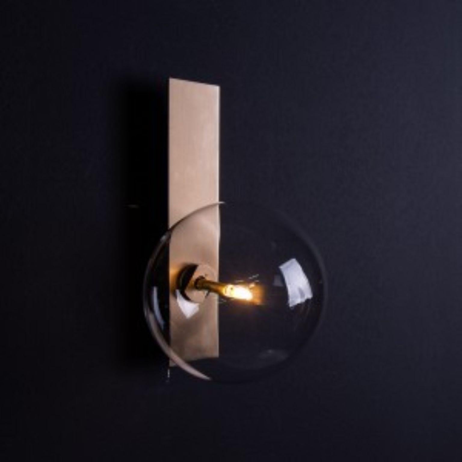 Oslo Brass Wall Sconce by Schwung
Dimensions: W 15 x D 19 x H 26 cm
Materials: Brass, hand blown glass globes

Finishes available: Black gunmetal, polished nickel, brass


Schwung is a German word, and loosely defined, means energy or momentumm of a