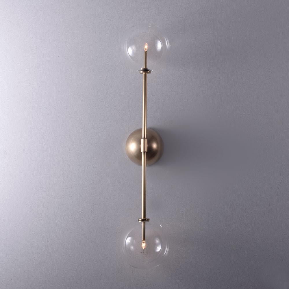 Miron Brass wall sconce by Schwung
Dimensions: W 15 x D 16 x H 79 cm
Materials: Brass, hand blown glass globes

Finishes available: Black gunmetal, polished nickel, brass


Schwung is a German word, and loosely defined, means energy or momentumm of