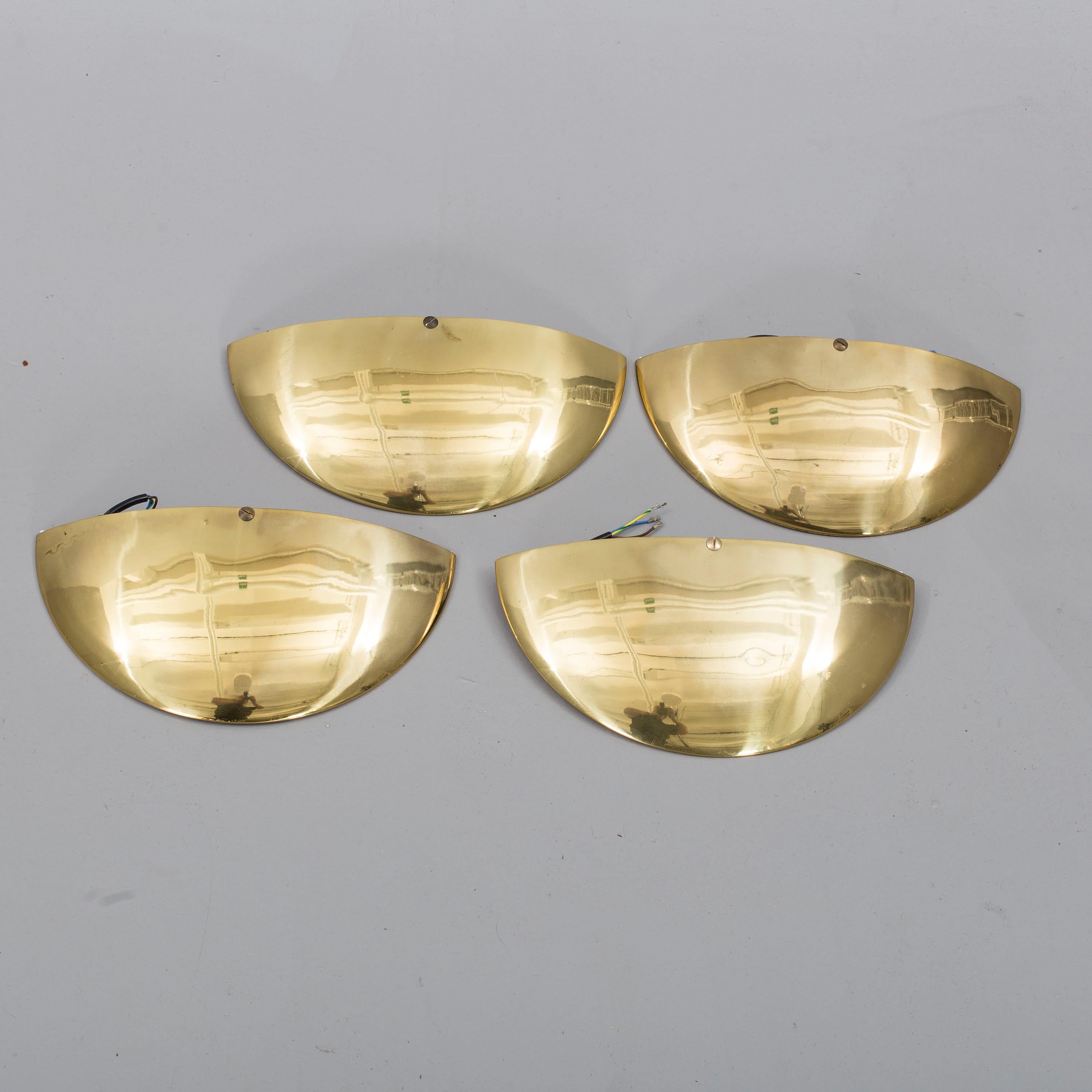 Solid brass wall sconces, made in mid-20th century. Two sets of four available.