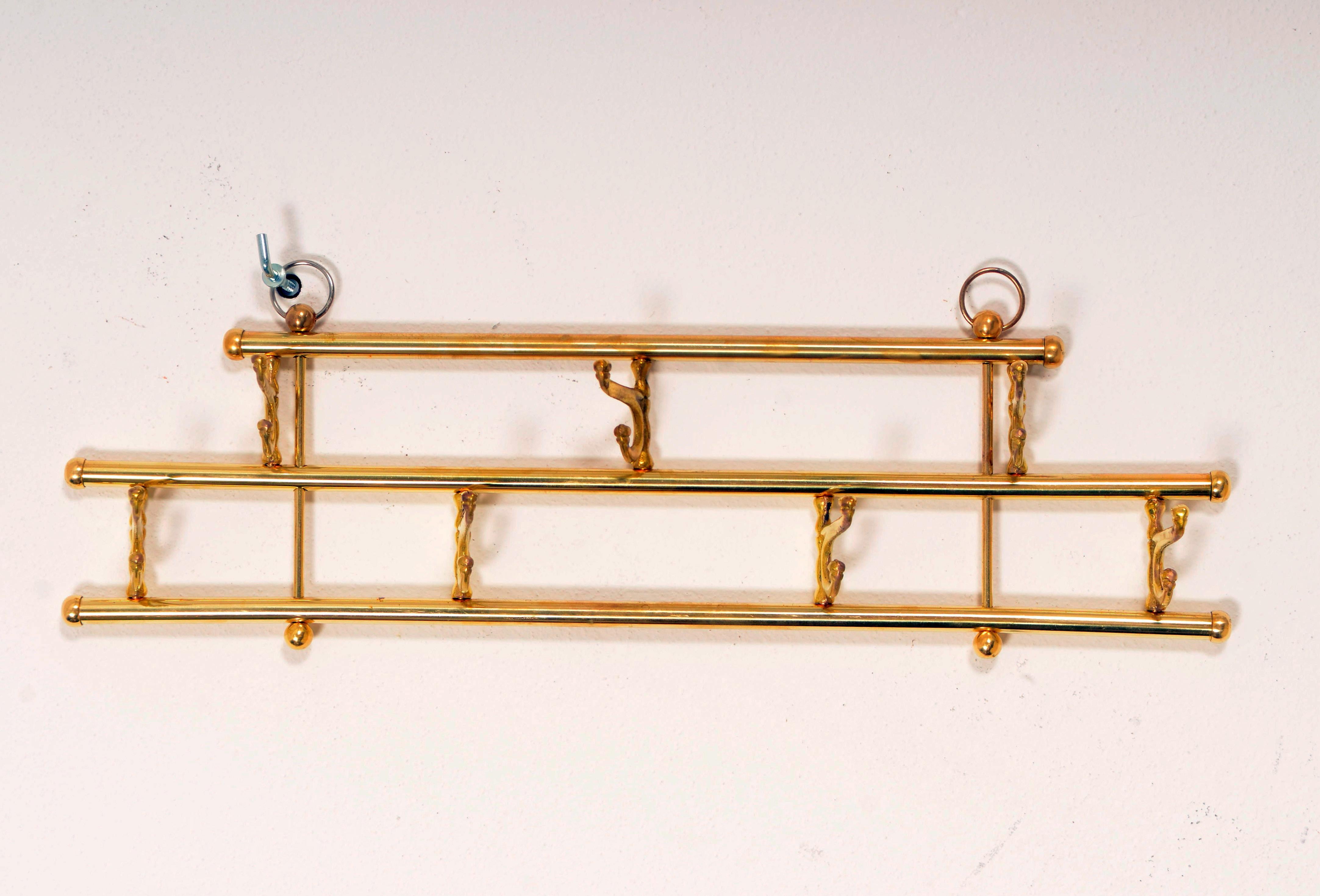 Brass wardrobe, hanger, hat rack made in the early 1950s in Vienna. Up to two pieces available, price per piece.
 