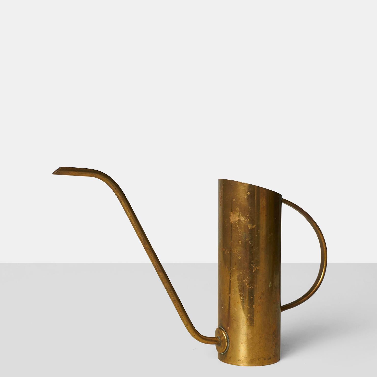 A handmade brass watering can by Werkstatte Hagenauer Wien. Stamped and marked on the underside.