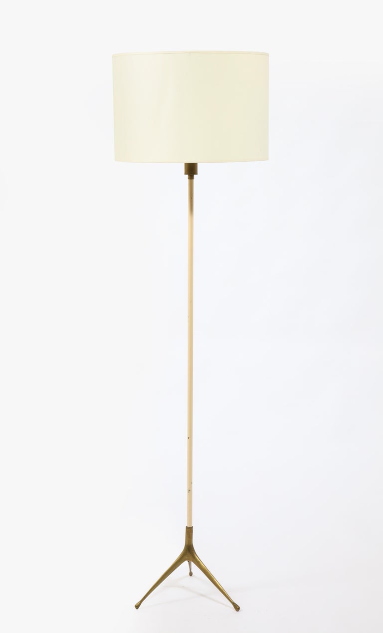 Minimalist brass and white enameled metal floor lamp. 

Shade not included.