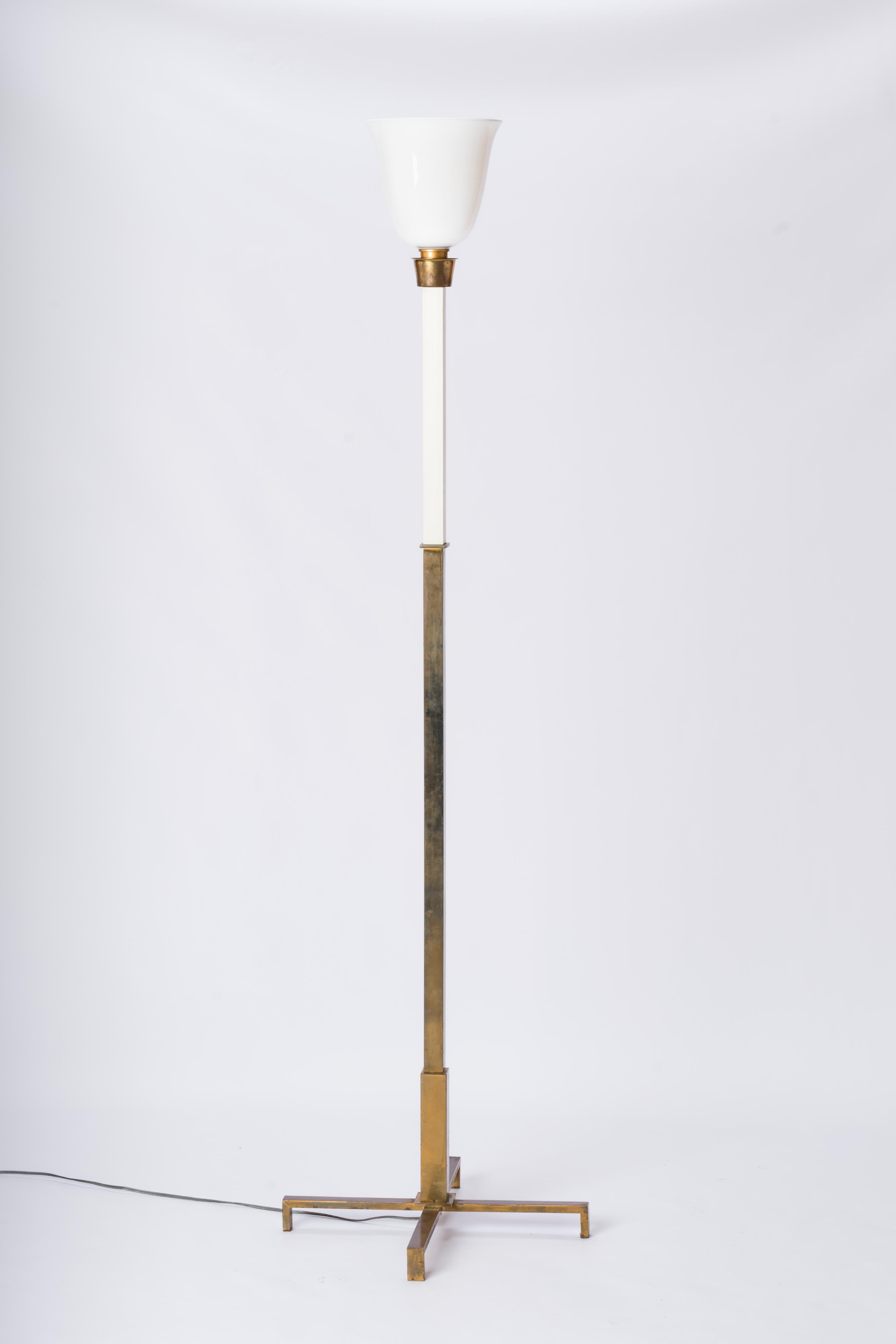 Arbus inspired neo-classical floor lamp featuring a patinated brass base and a white lacquered steel extension topped by a mil glass opaline. Original 