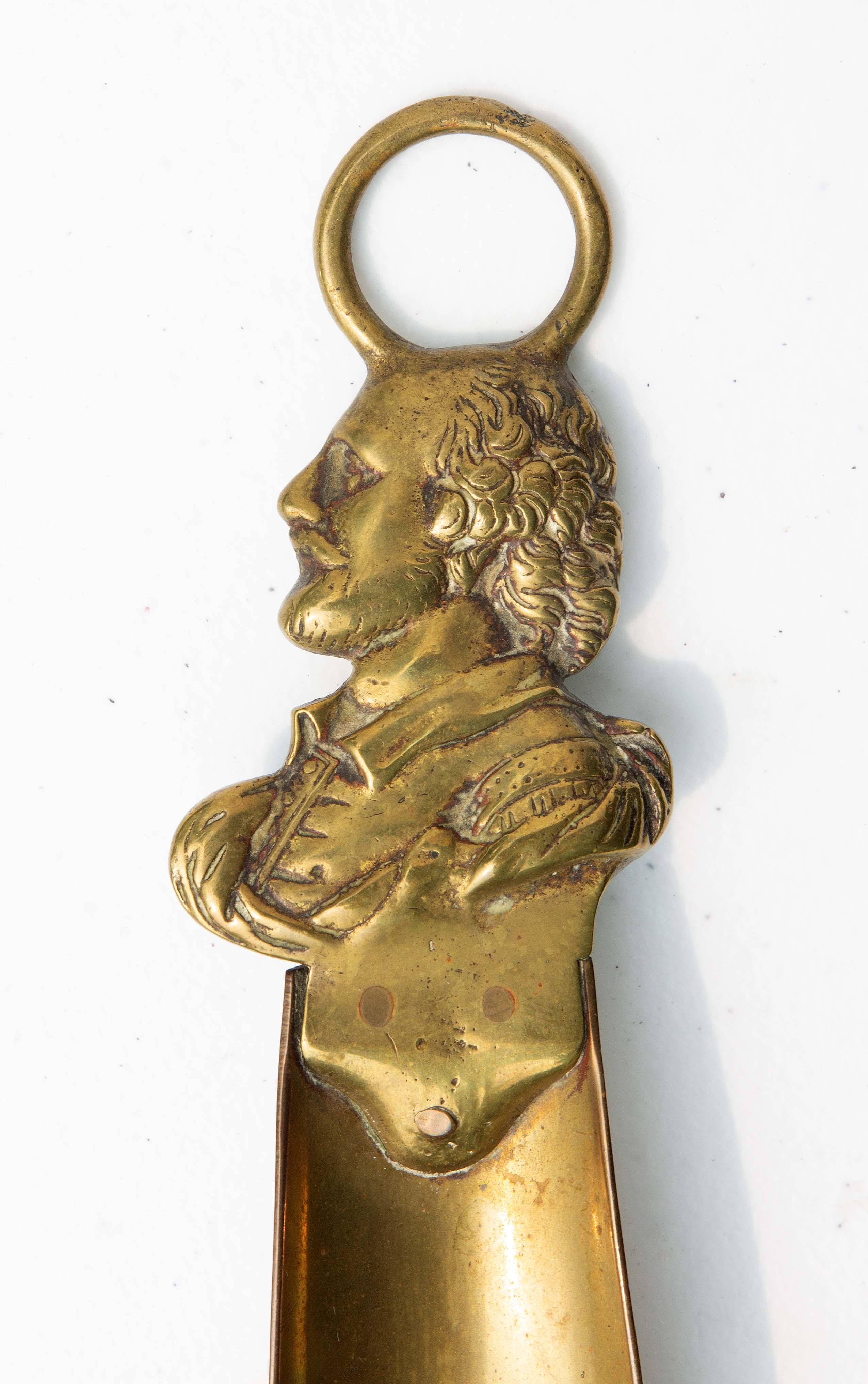 English brass shoehorn with the portrait of William Shakespeare, circa 1820.