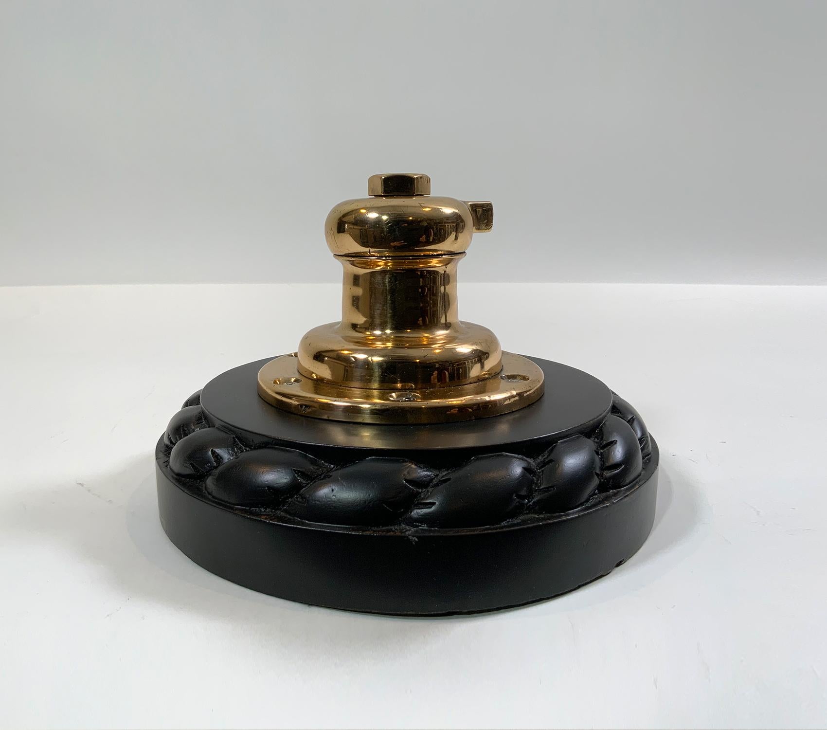 Yacht Winch mounted to a rope carved mahogany base. Polished and lacquered. 

Overall Dimensions: 7