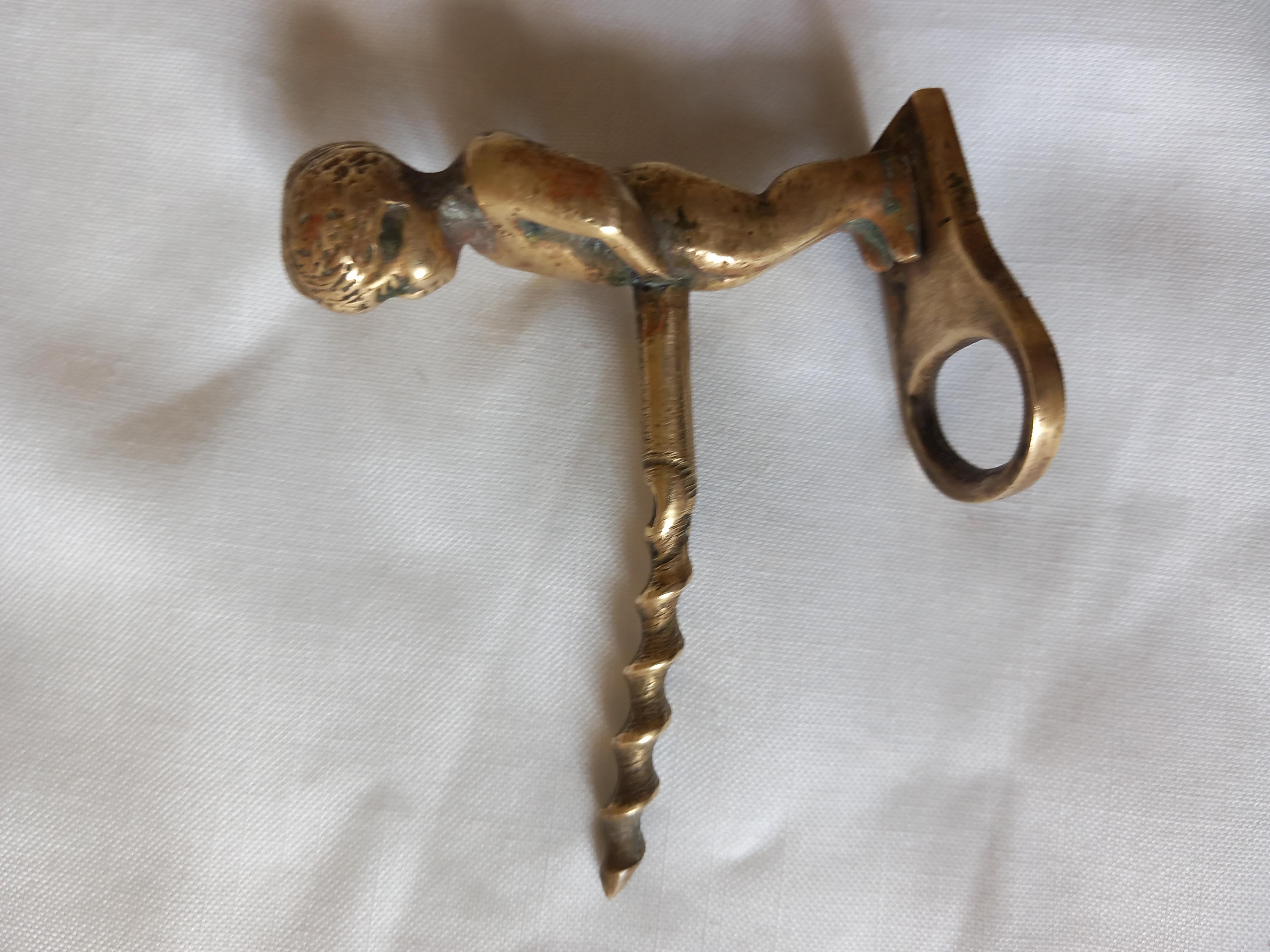 20th Century Brass Wine and Bottle CAP Opener Putto For Sale