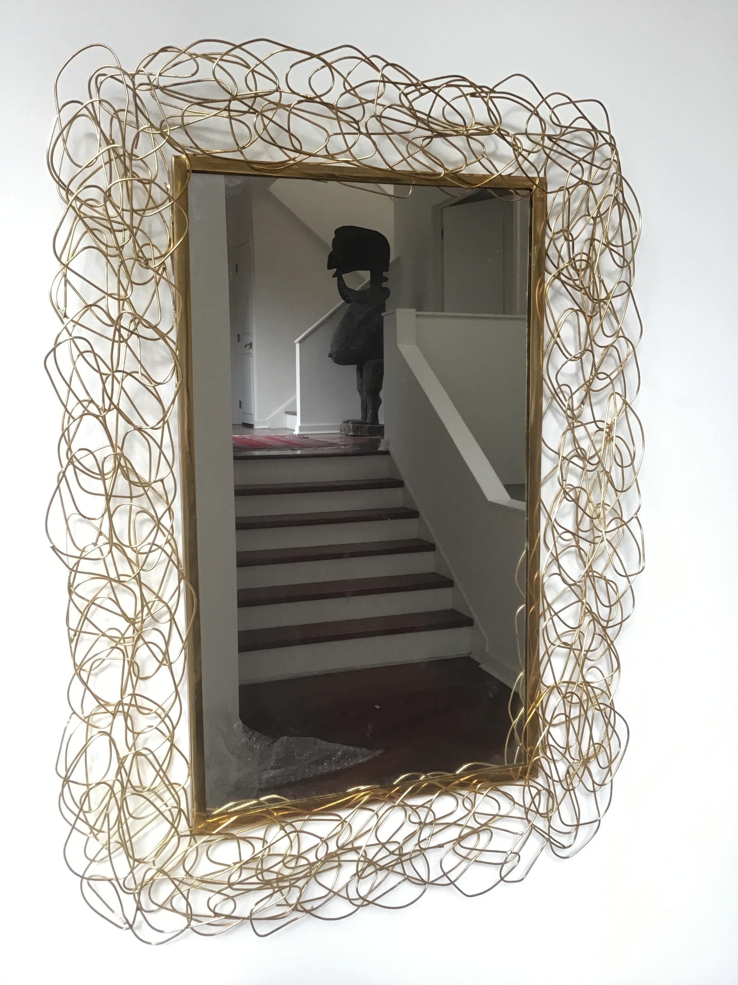 Brass wire mirror.
This item can be shipped via UPS.