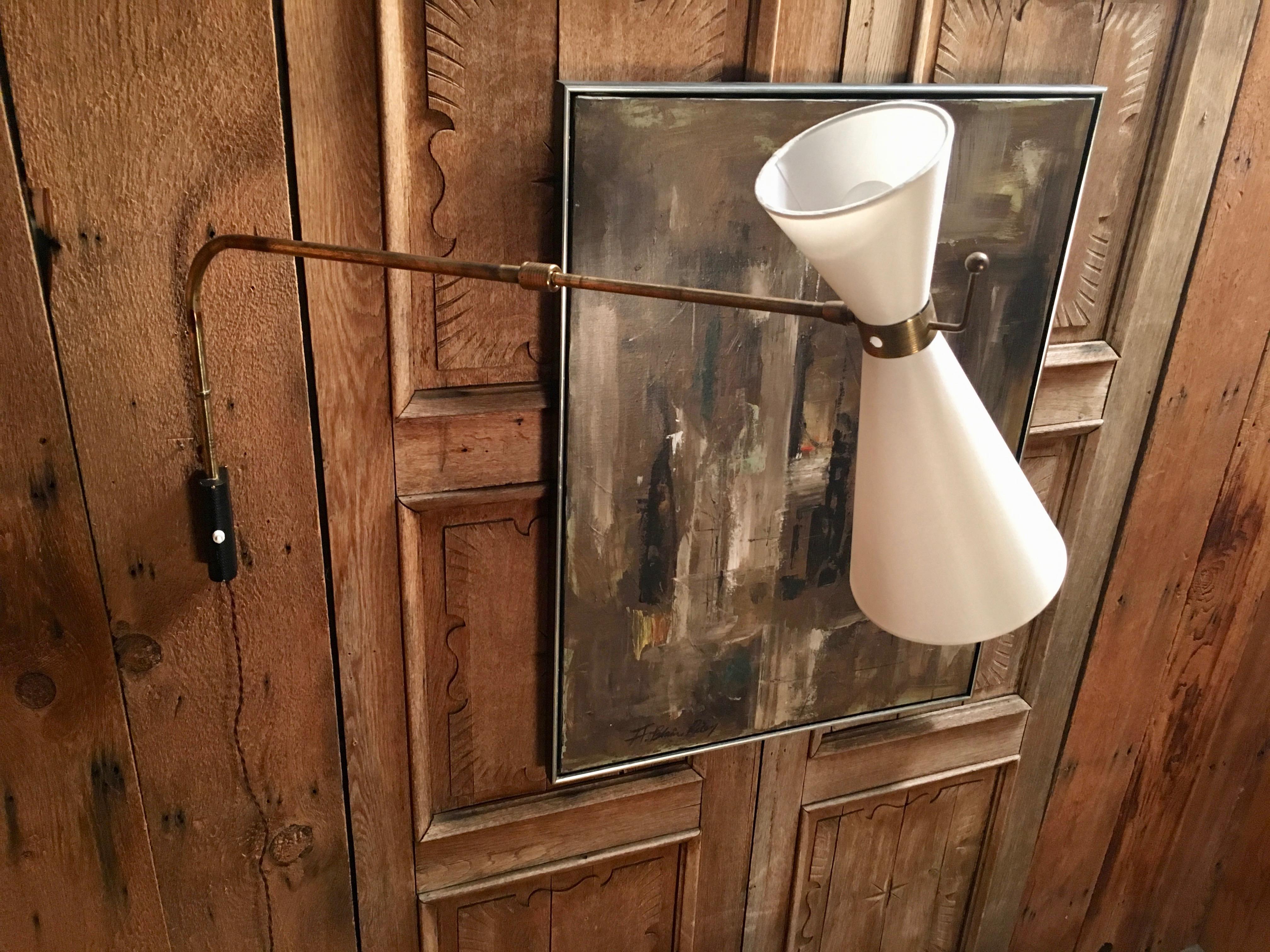 Vintage brass with steel adjustable length sconce with a newer linen shade
Length not extended 30 L.