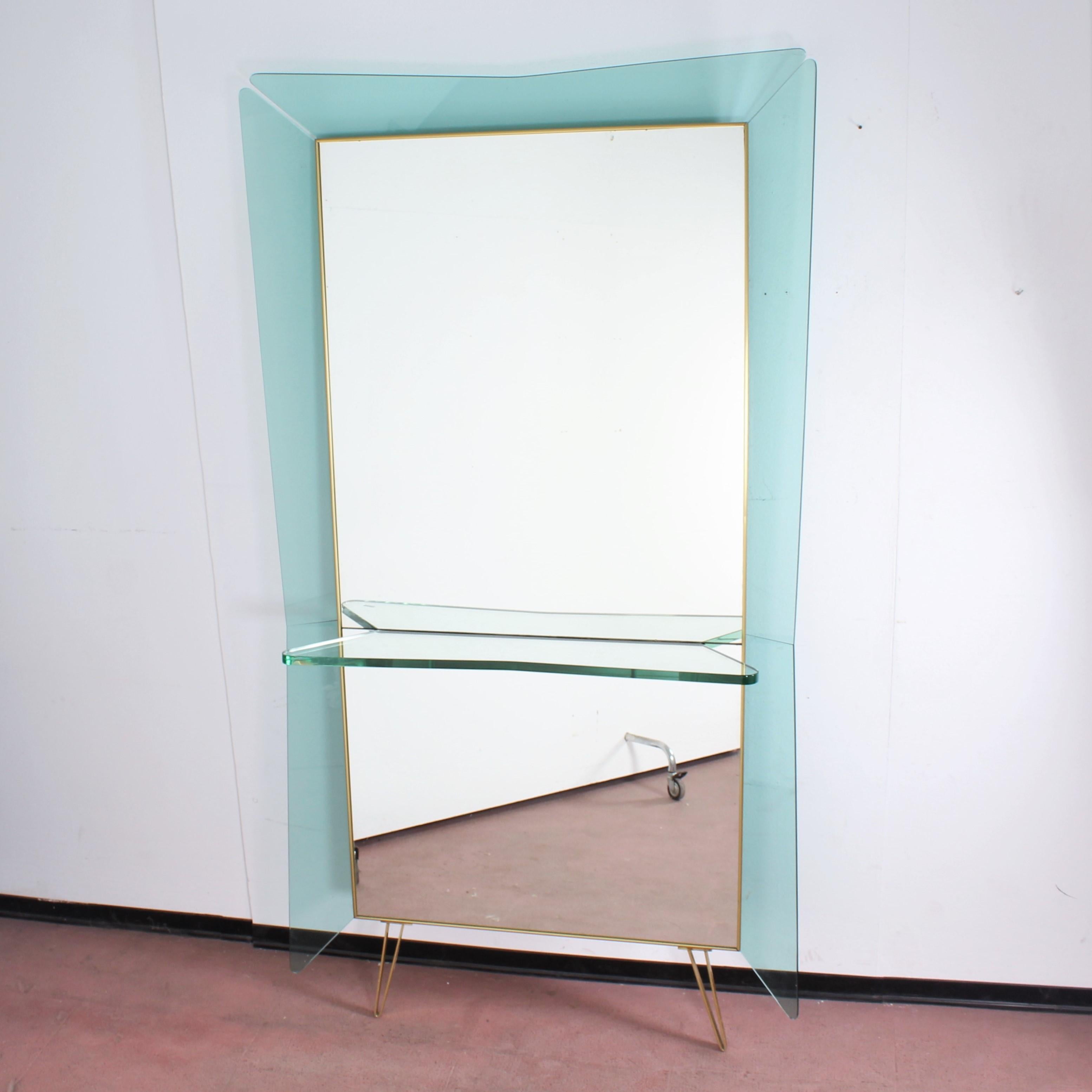 Majestic and very beautiful brass and wood console with a big mirror with large green curved glass frame and thick glass shelf. Mod. 2697 made by Cristal Art Torino, 1940s, Italy.

Good condition, wear consistent with age and use.