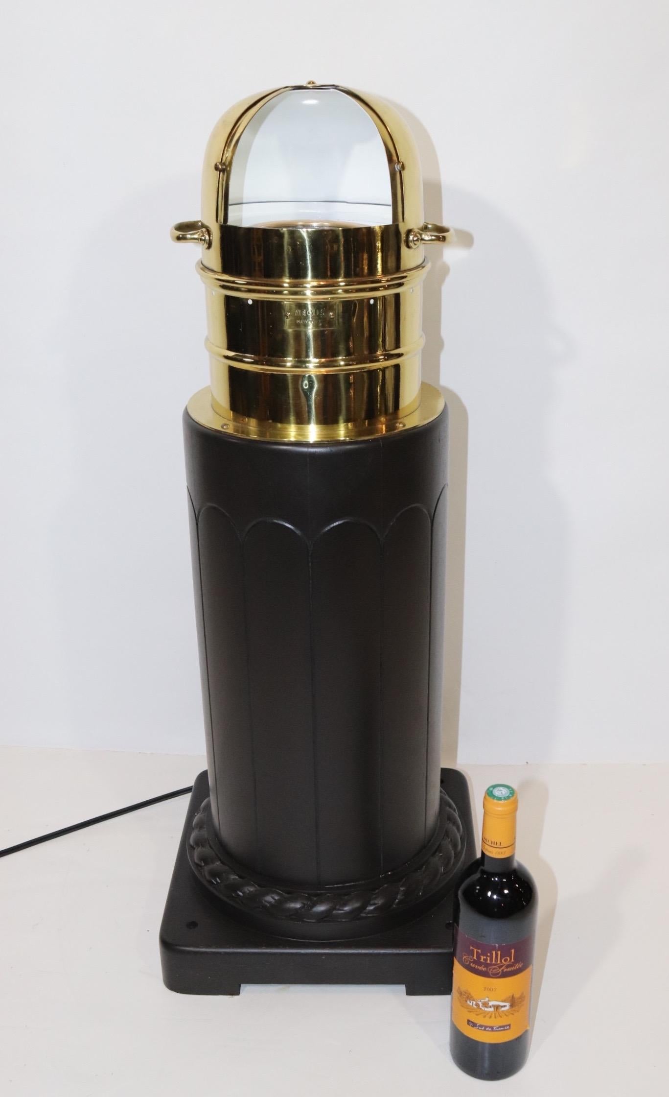 Choice solid brass polished and lacquered yacht binnacle from circa 1930. Mounted to a custom made pedestal with rope carving at the base. Brass binnacle shroud has a mounted name plate from ship chandler Negus of New York. Interior is painted white