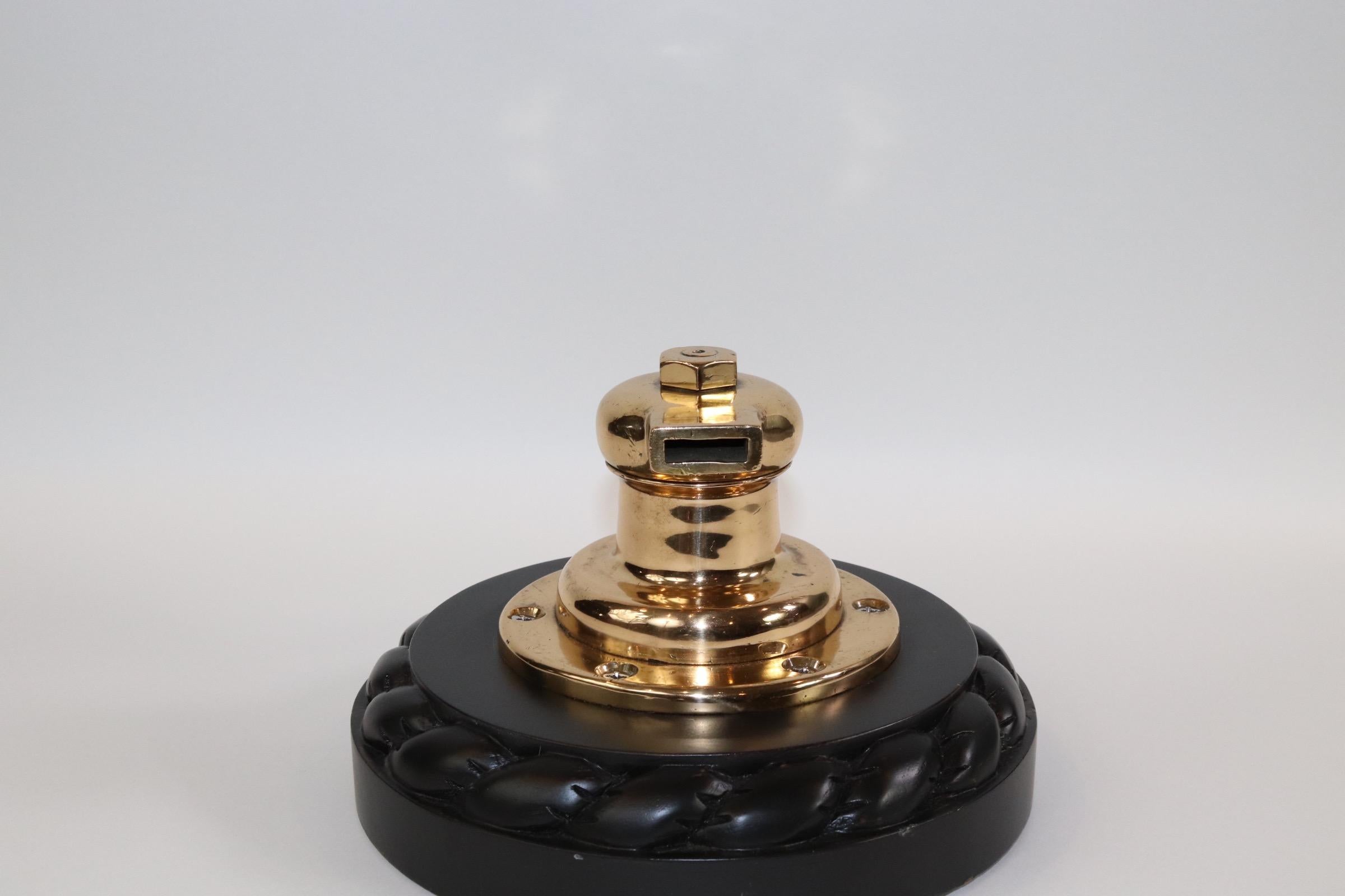 Quality geared yacht winch that has been polished, lacquered and mounted to a thick wood base with carved rope border. Weight is 11 pounds.