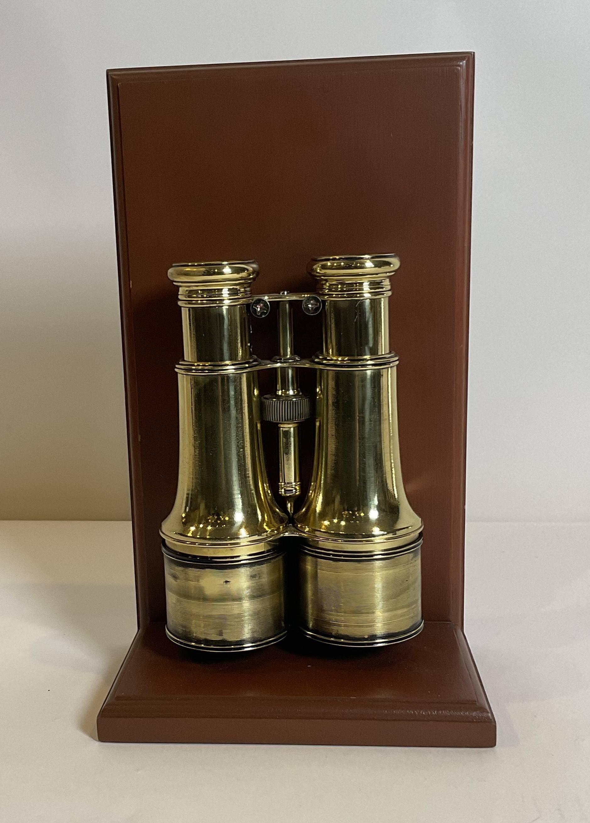 Vintage library or yachting binoculars circa 1910. Polished and lacquered. With smooth focal gear. Fitted with extending sunshades. French made. 12
