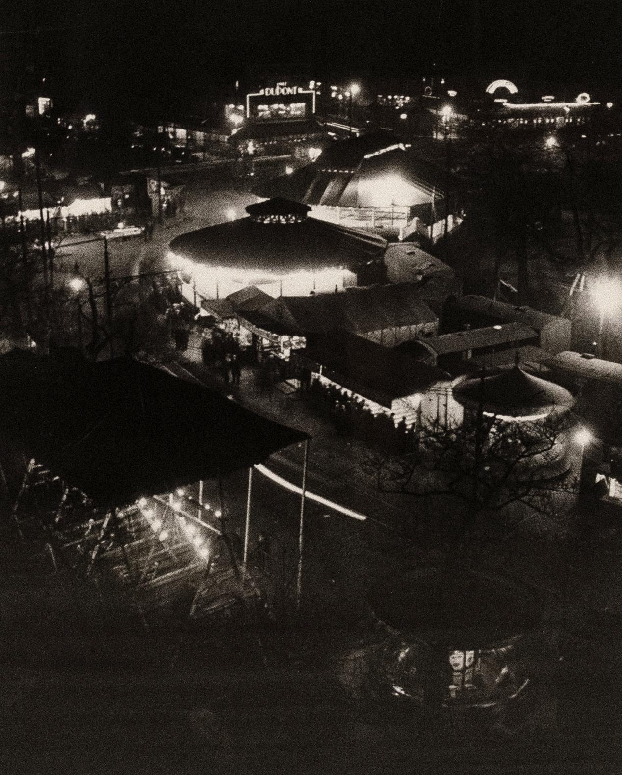 BRASSAI (Hungarian–French, 1899-1984)
Street Fair on the Place d'Italie, 1931
Medium: Sheet-fed Gravure
Printing Date: 1970's
Printed in the USA
Image: 10 1/2 x 8 inches
Framed: 14 1/2 x 12 inches

Although his real nameis Gyula Halasz, he took the