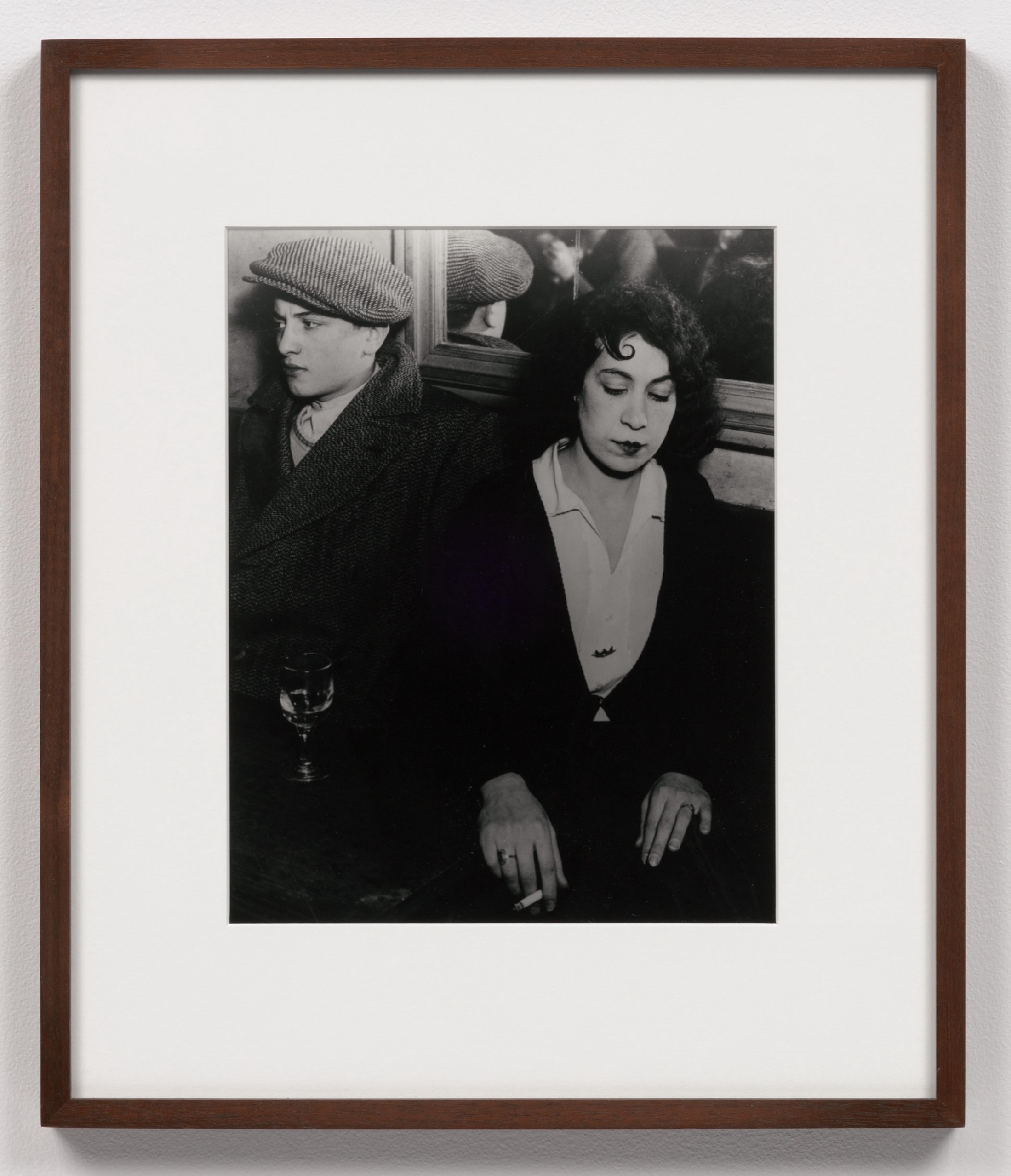 Brassaï Black and White Photograph - Couple fâché au bal des Quatre-Saisons, rue de Lappe