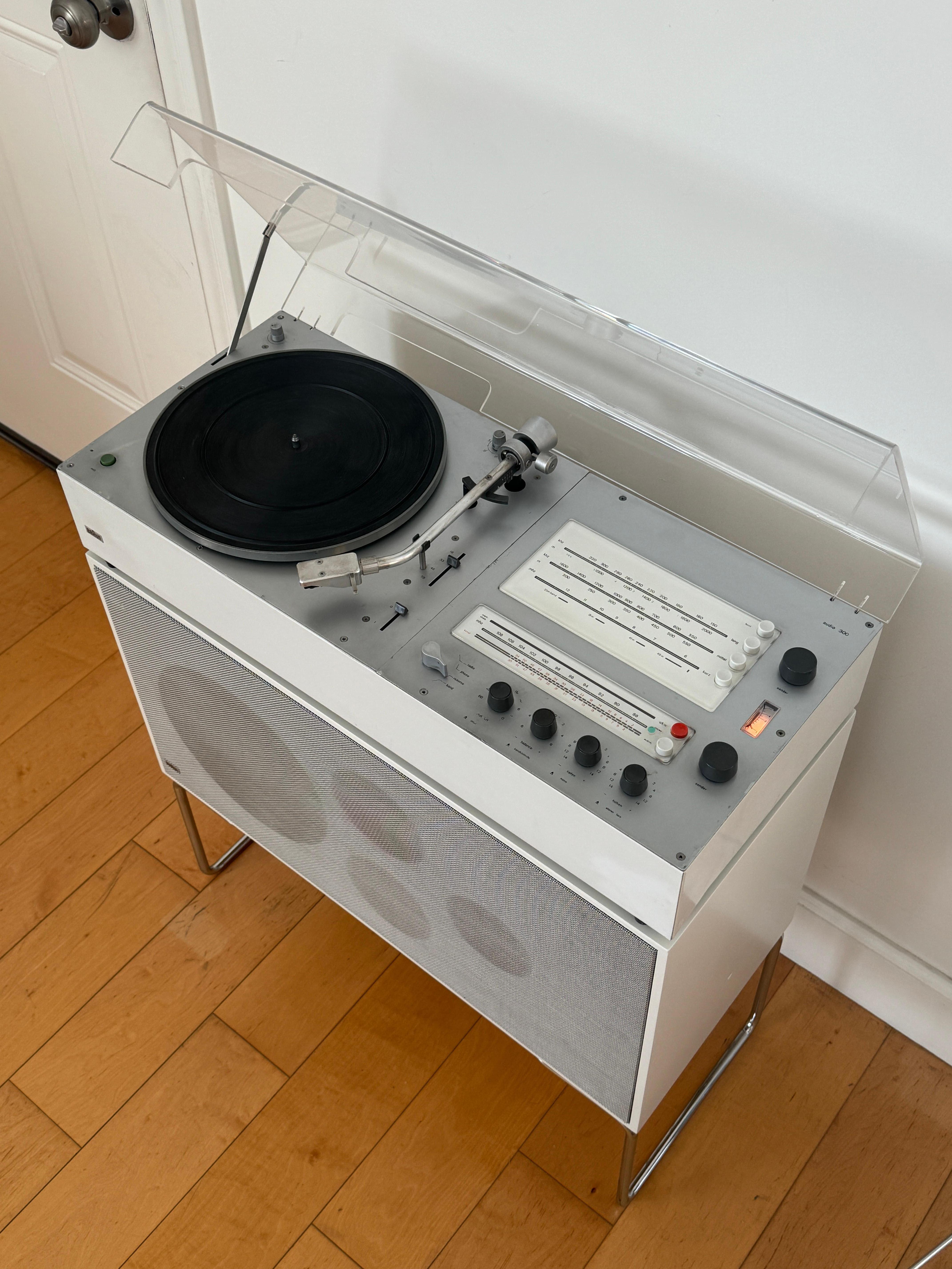 Braun Audio 300 and rare L61 floor speaker designed by Dieter Rams, 1960's/70's. Equip with AM/FM radio and record player. Fully functional and has been serviced by a technician.