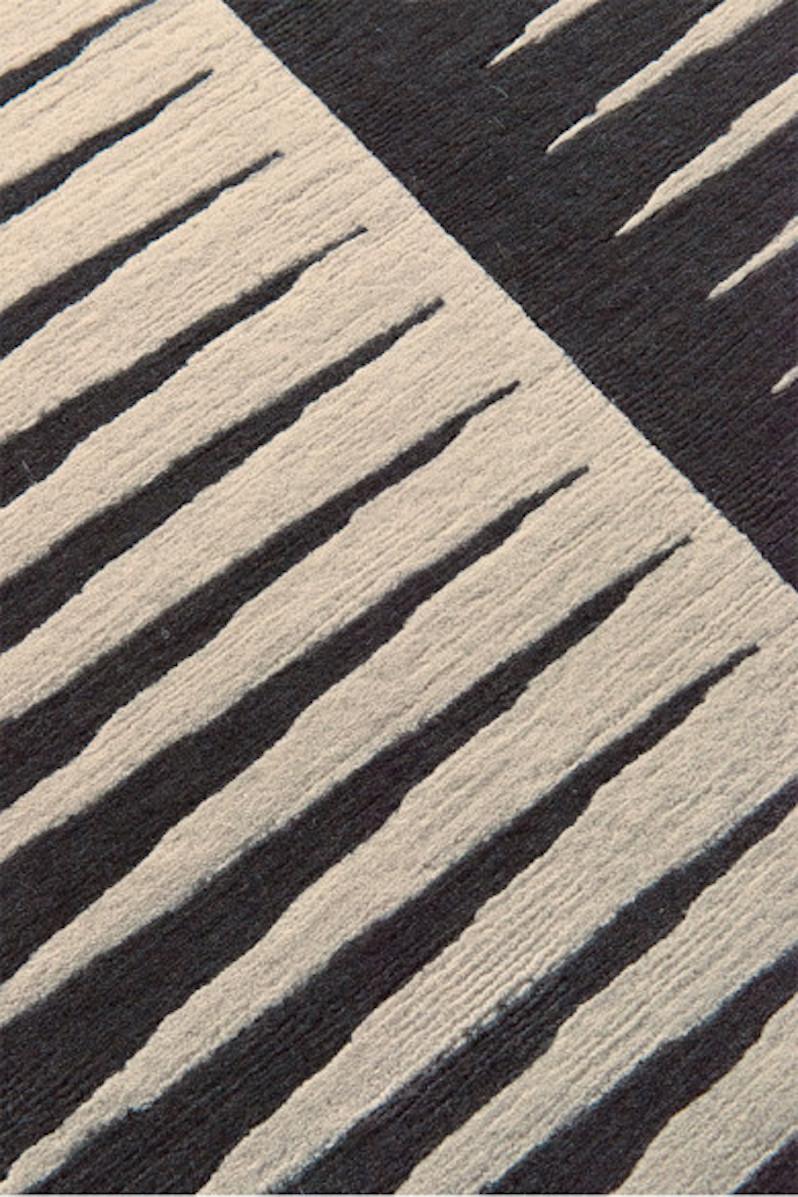 Bravado Graphite is inspired by Kelly’s custom stair runner in her 1930s Georgian style home in Beverly Hills. Its graphic angular design is contrasted in a combination of graphite and ivory wool motifs. The design is simple and impactful and
