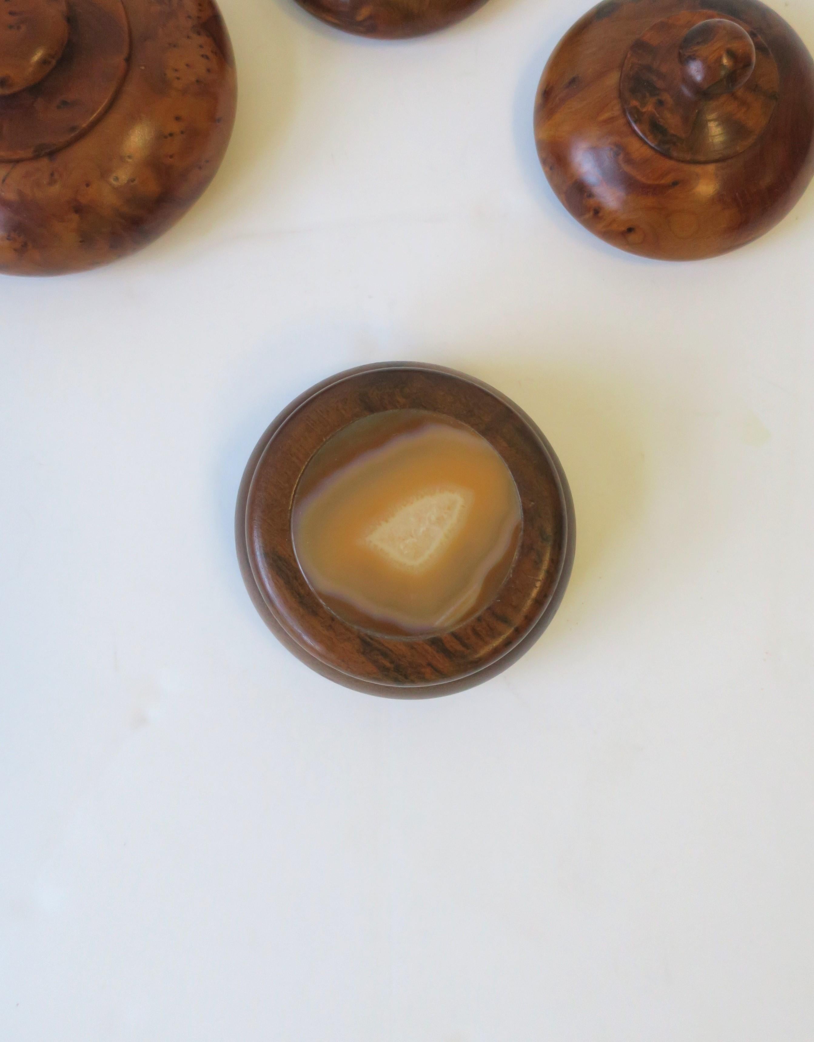 A round Brazilian agate onyx and wood trinket or jewelry box, in the Modern style Post-Modern period, circa-late 20th century, 1980s early 1990s, Brazil. Box has a rich brown wood with onyx agate hues in tan/neutral and white. Piece would suffice