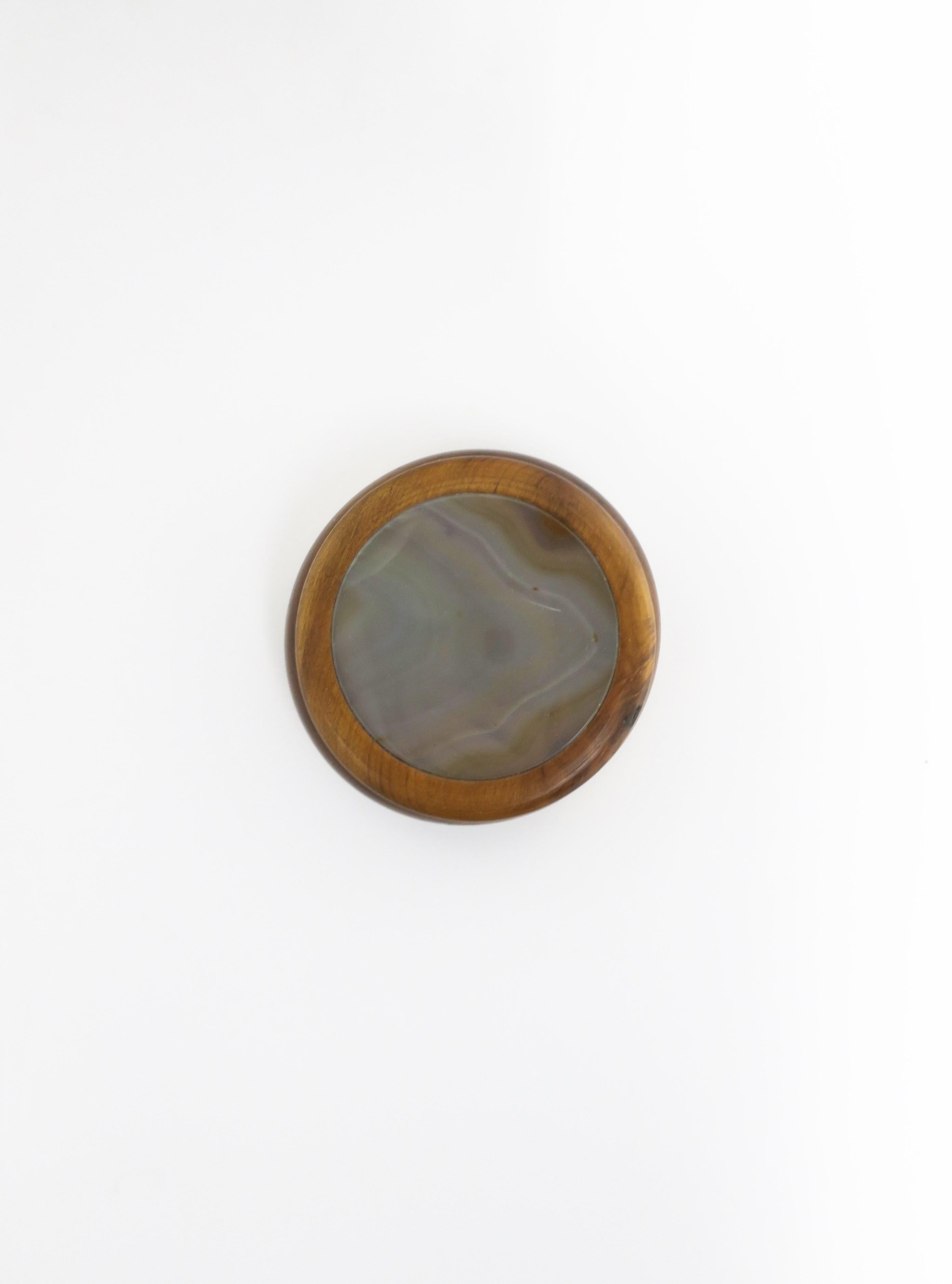 A Brazilian wood and agate onyx round jewelry or trinket box, in the Modern style/Post-Modern period, circa late 20th century, 1980s, Brazil. Agate is a light grey hue. Piece would suffice for a desk, vanity, nightstand table area, etc., for small